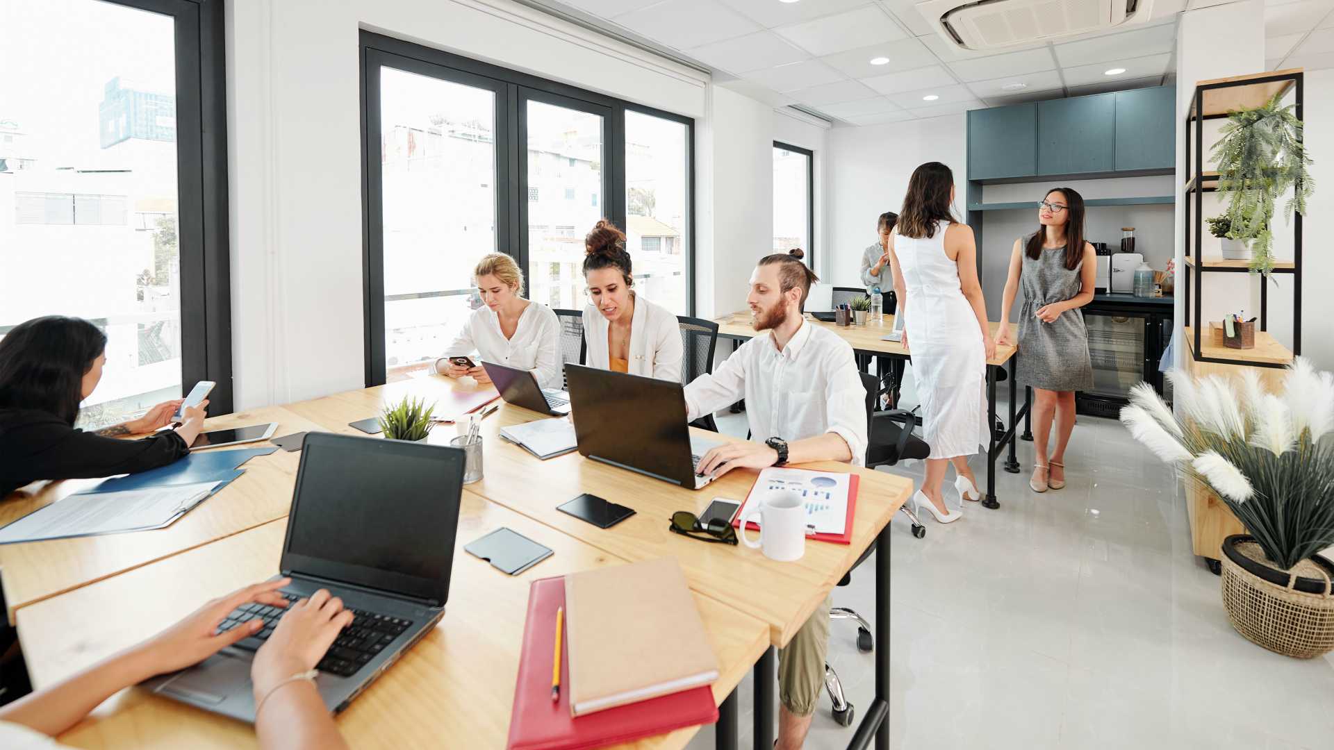 Diverse workforce collaborating in modern office space