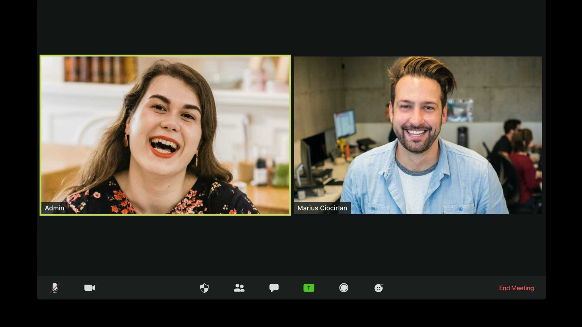 Two leaders videochatting, laughing and smiling at their web cameras