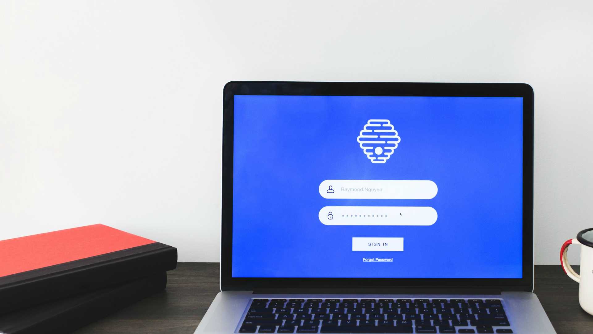Login screen on laptop sitting on desk