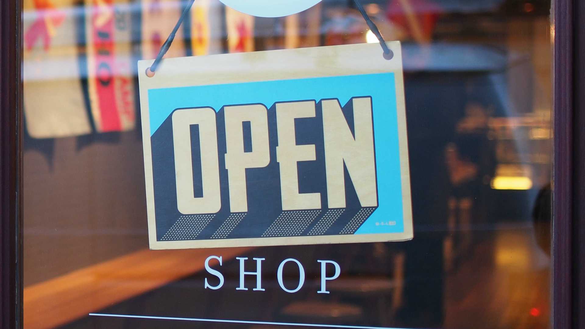 Open sign on glass shop window