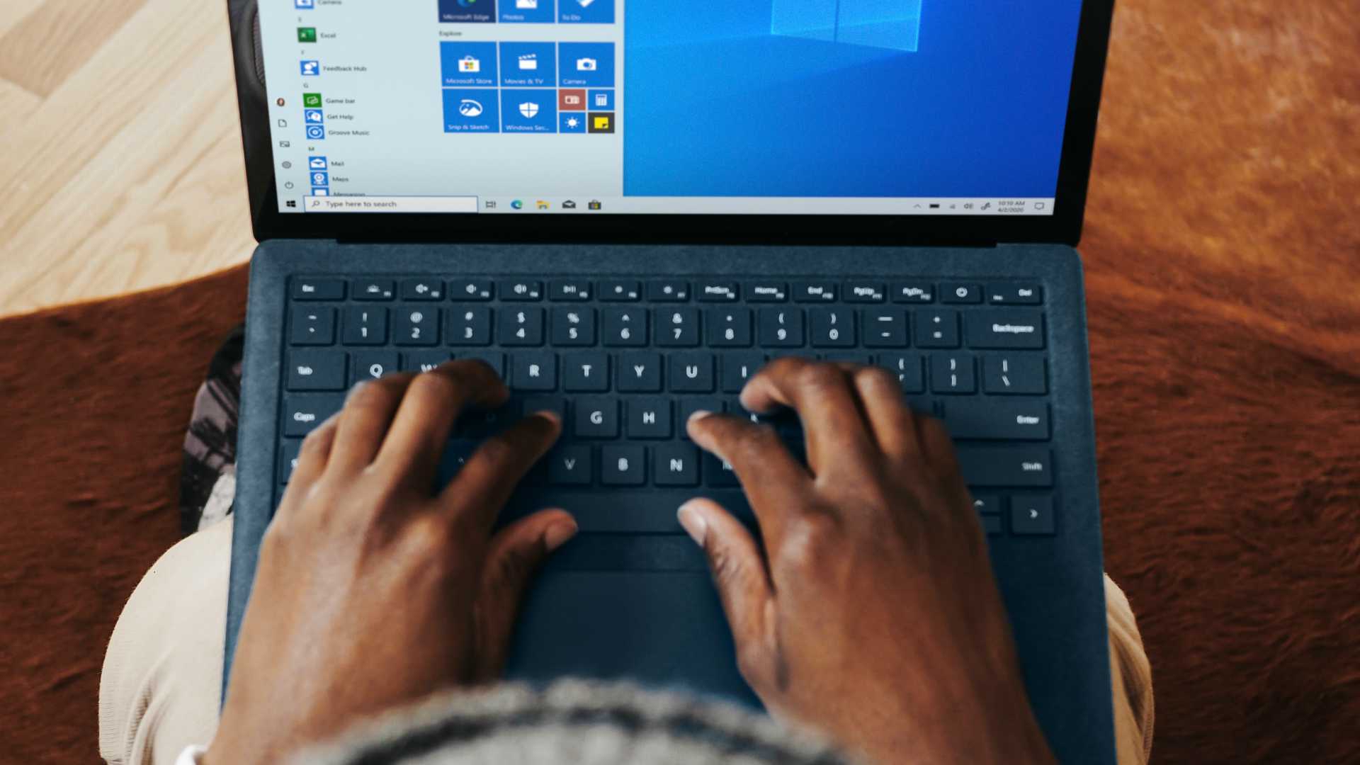 Aerial shot of business person typing laptop