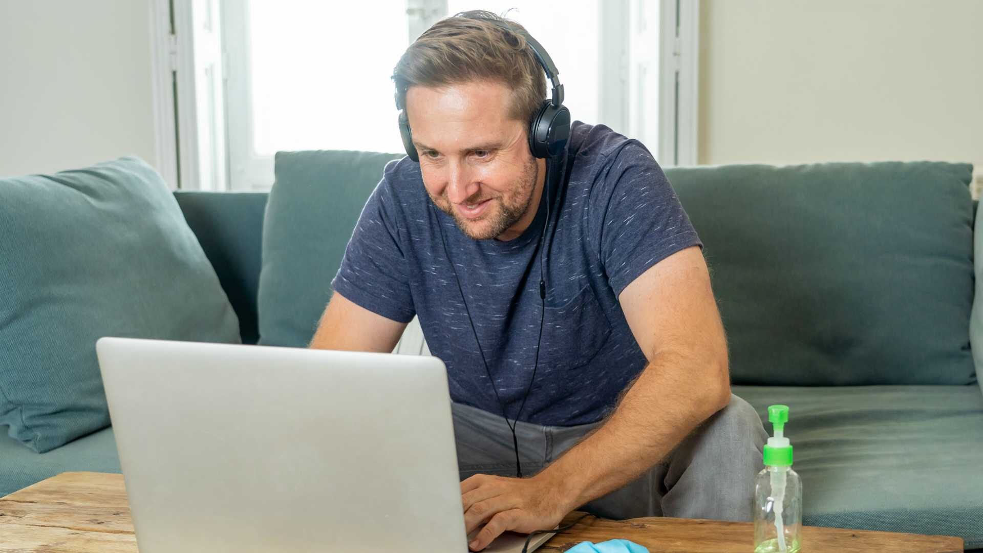 Freelancer on computer on a video conference with employees working remotely.