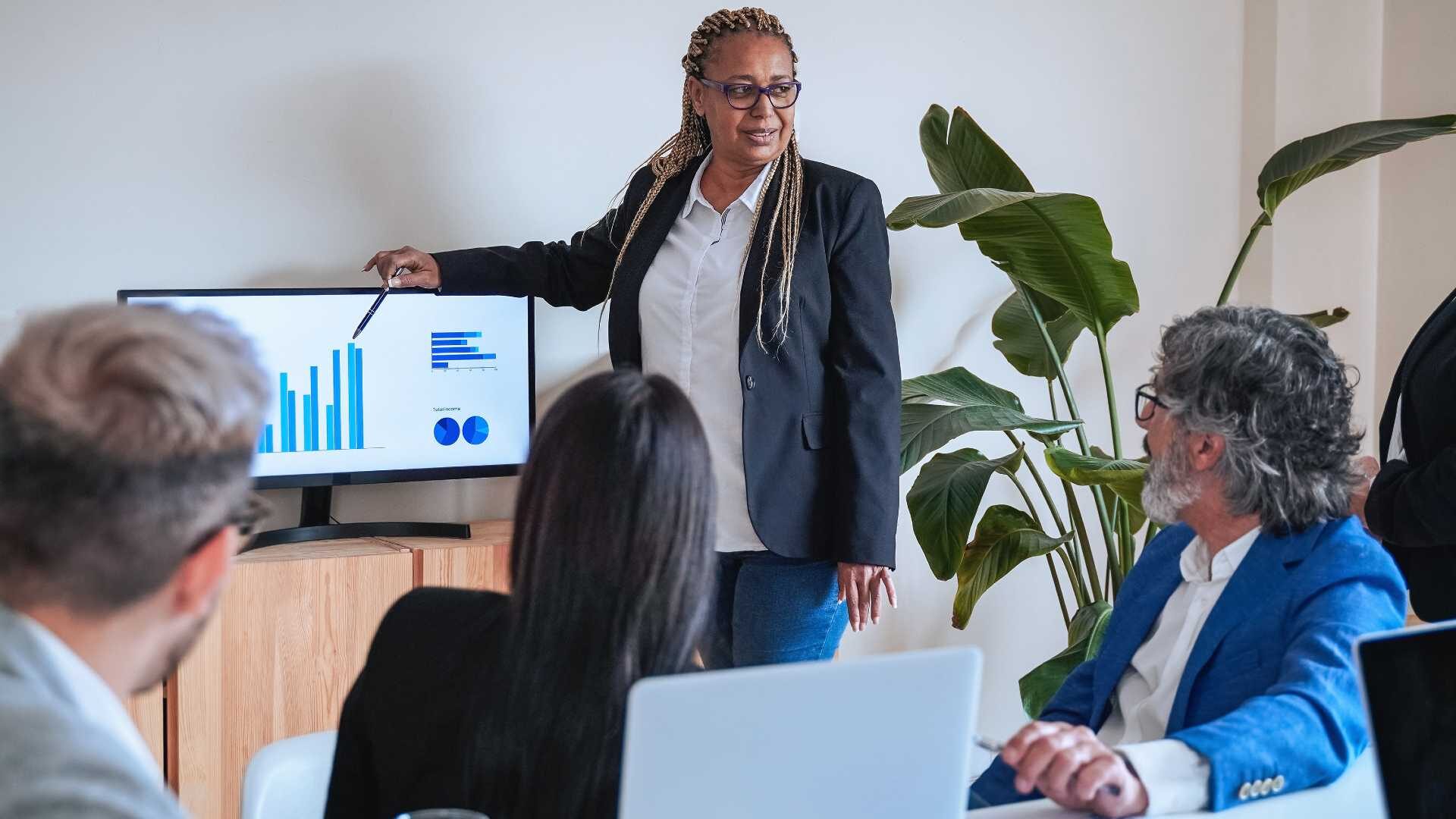 Business people working on finance project meeting inside an office