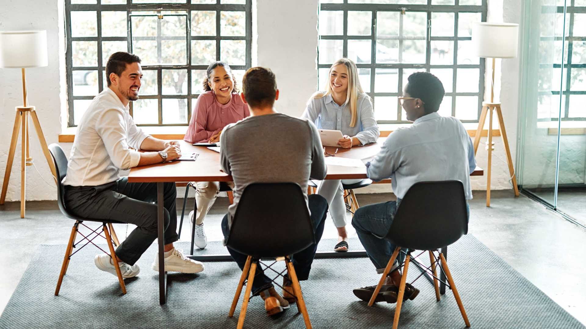 Group of young business people having a meeting or presentation and seminar with whiteboard in the office.