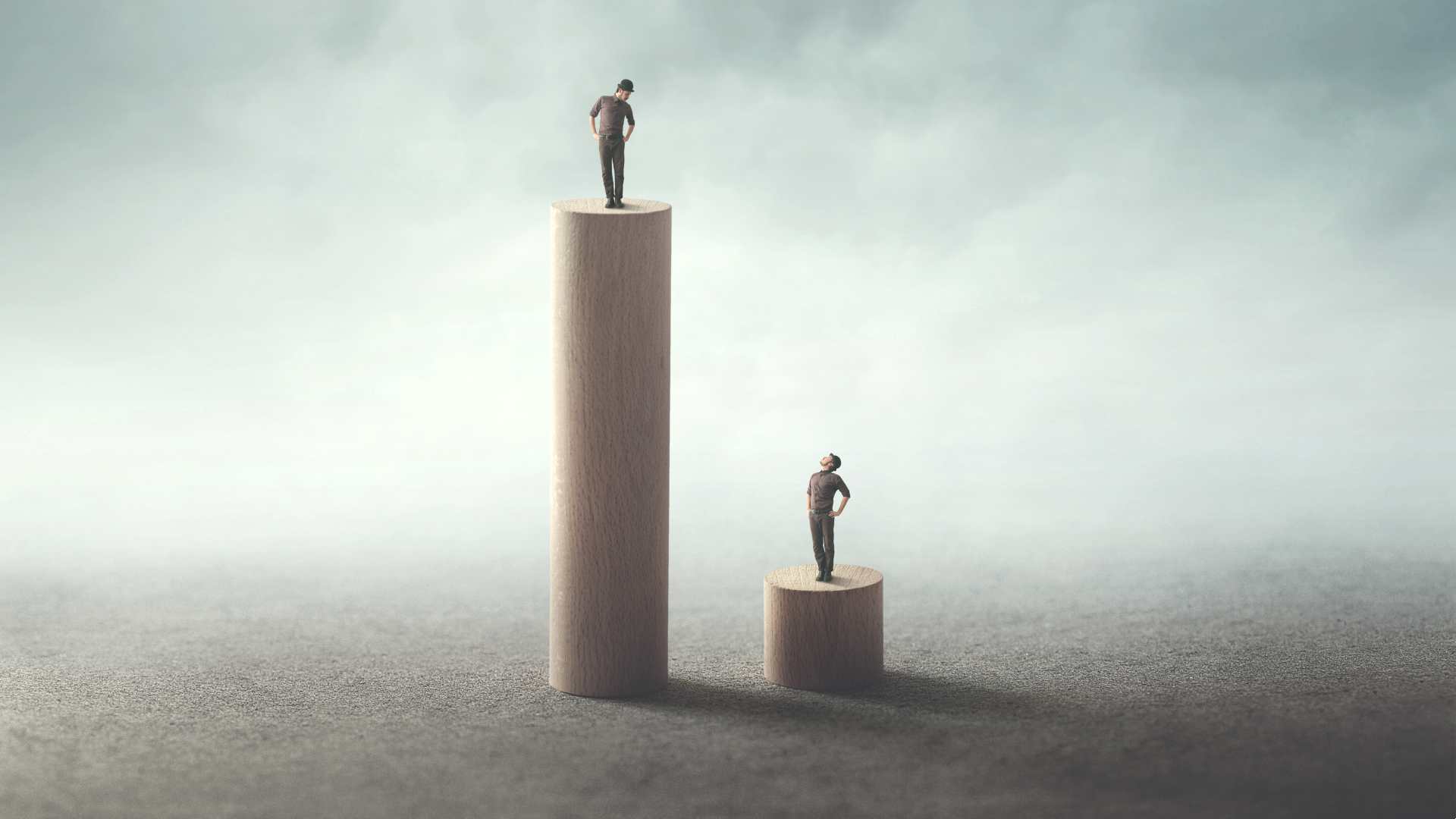 An individual is on a tall pedestal looking down at someone beneath them