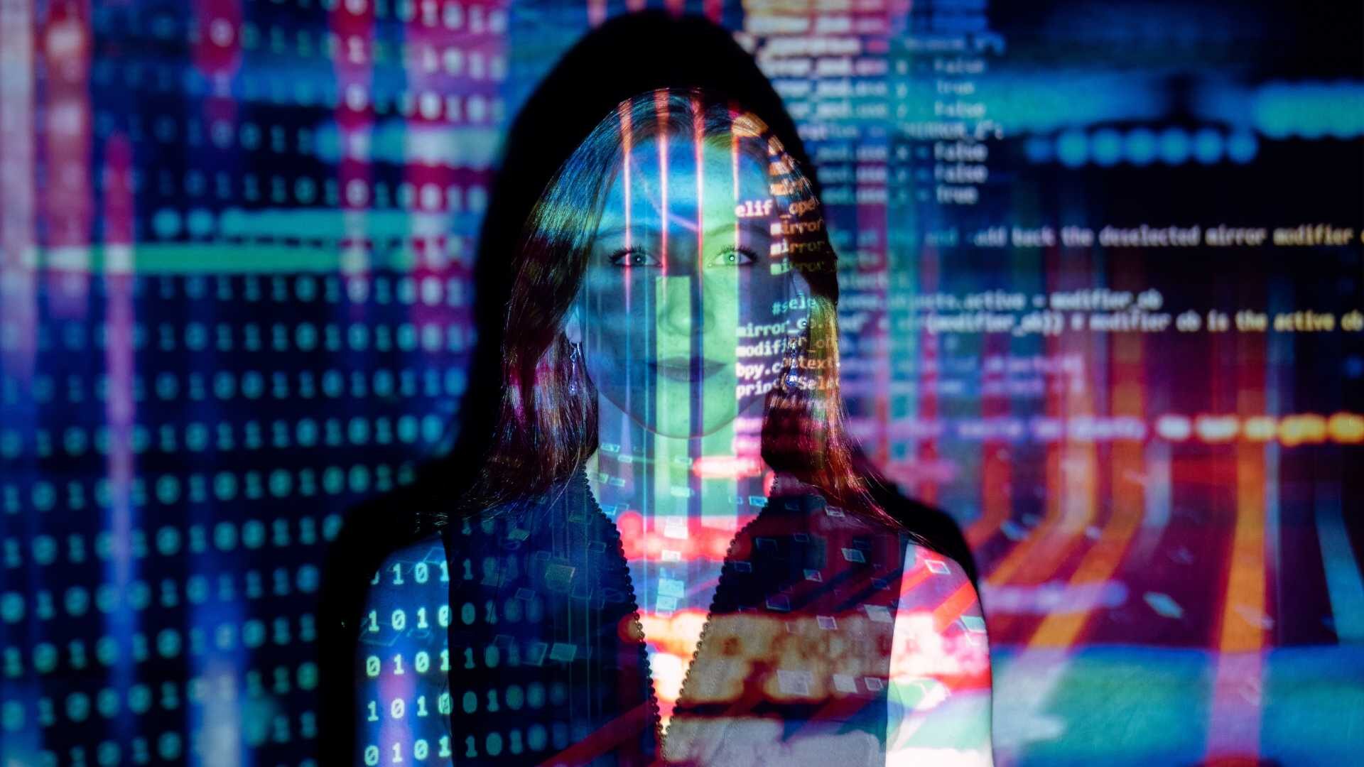 A picture of a woman with code written over the surface