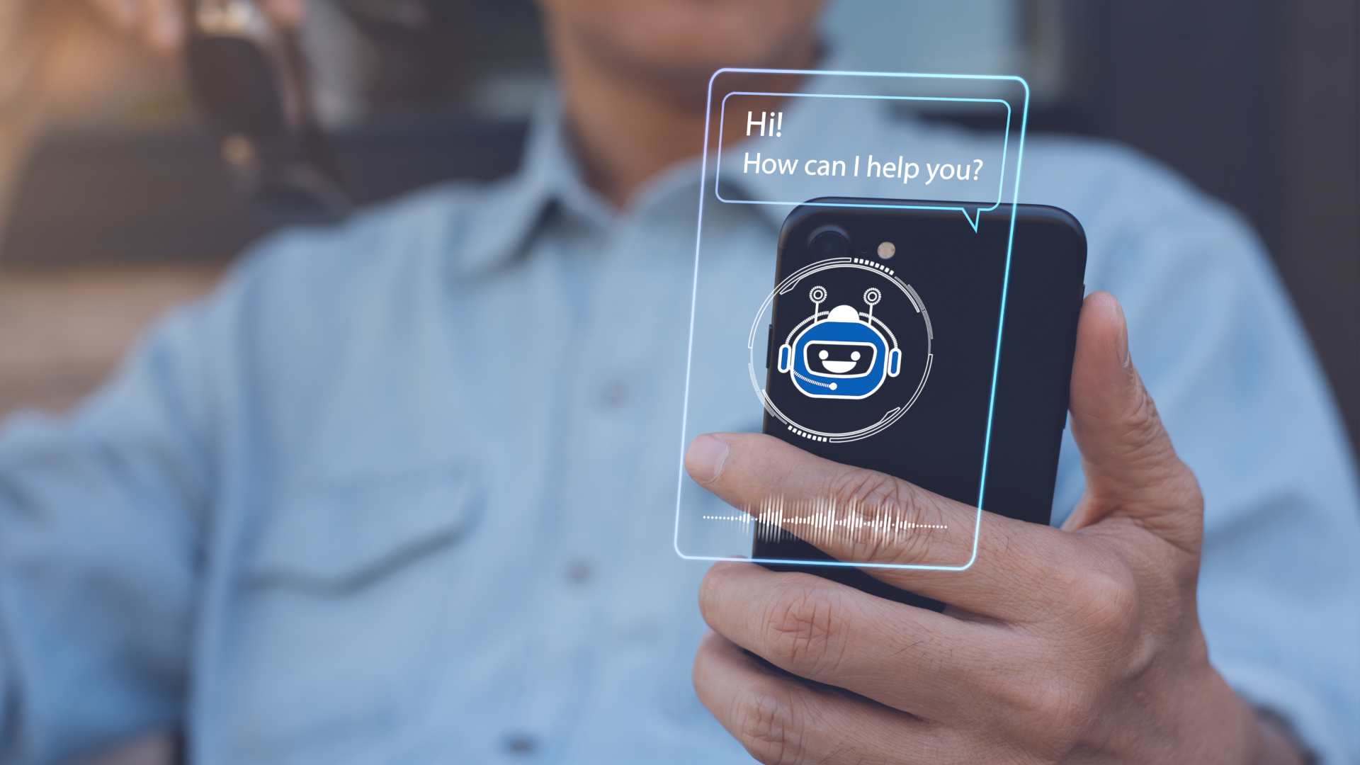person using a chatbot via mobile smart phone application with speech bubble on virtual screen