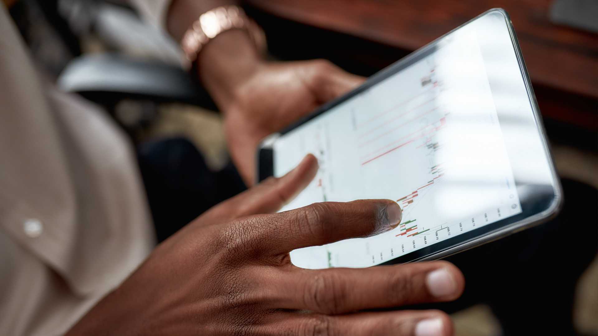 Close up shot of hands holding tablet pc