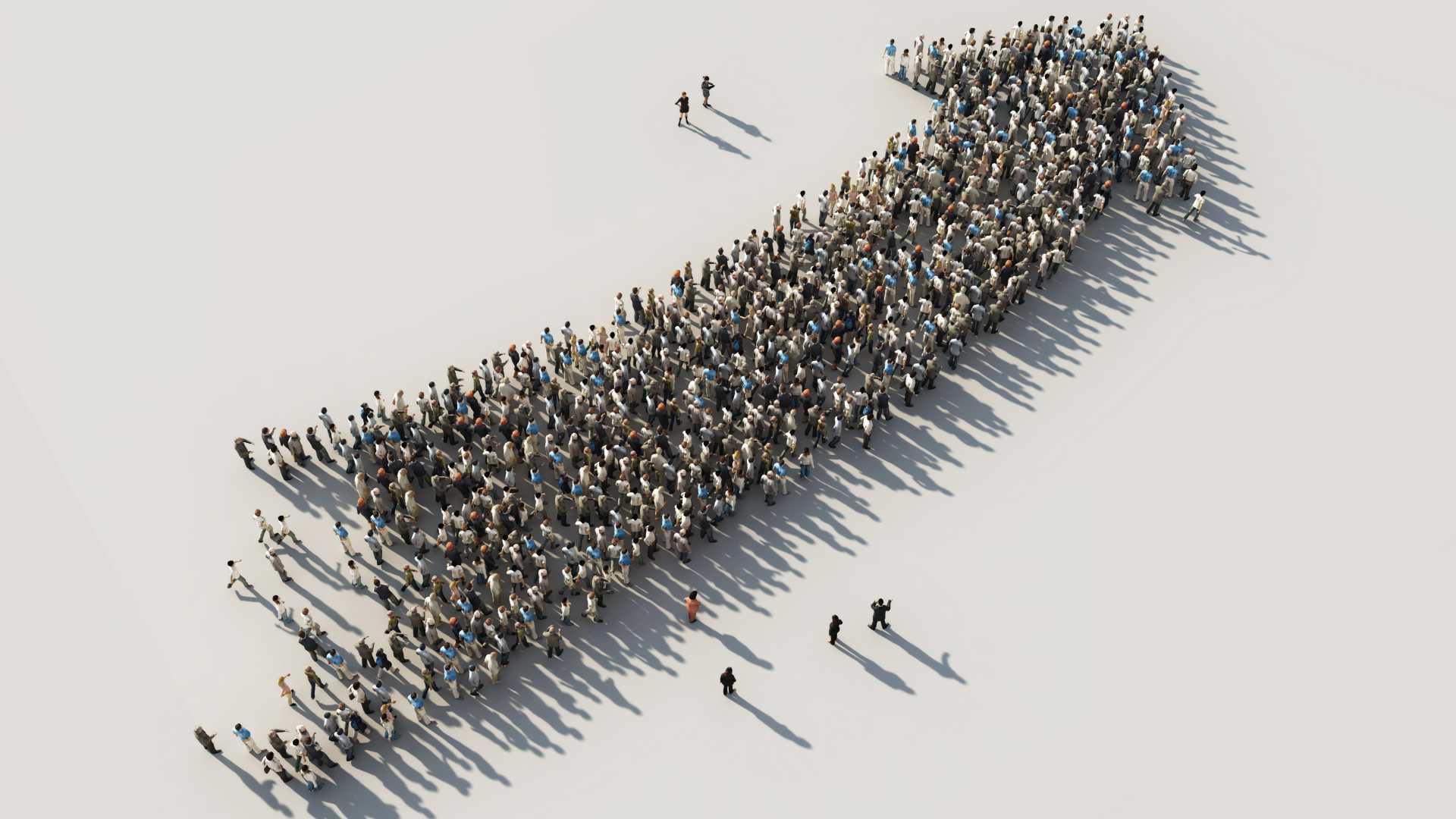 A large group of people stands in an abstract, white setting; we're viewing them from above, and they're standing in the shape of a big arrow pointing to the upper right of the image.
