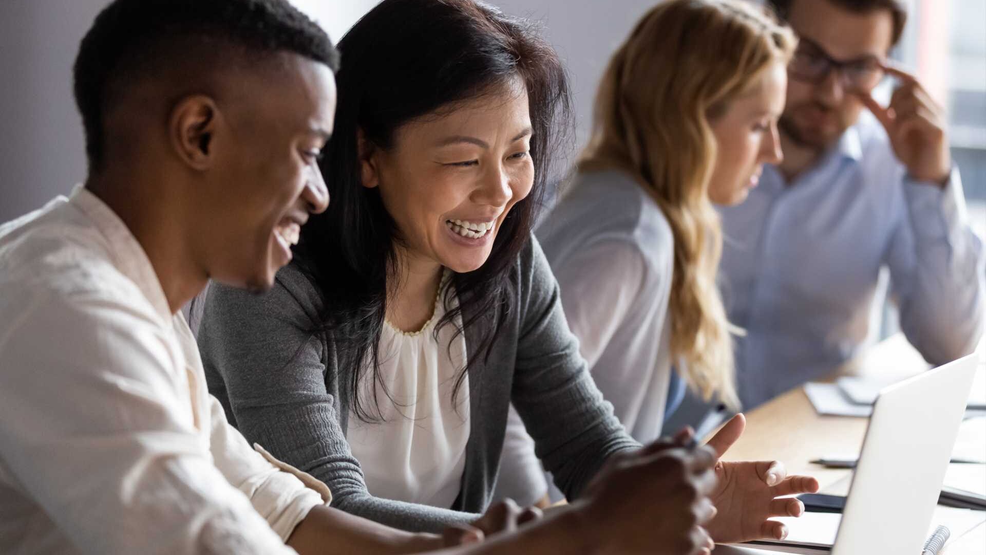 A group of colleagues and leaders collaborating in an office space