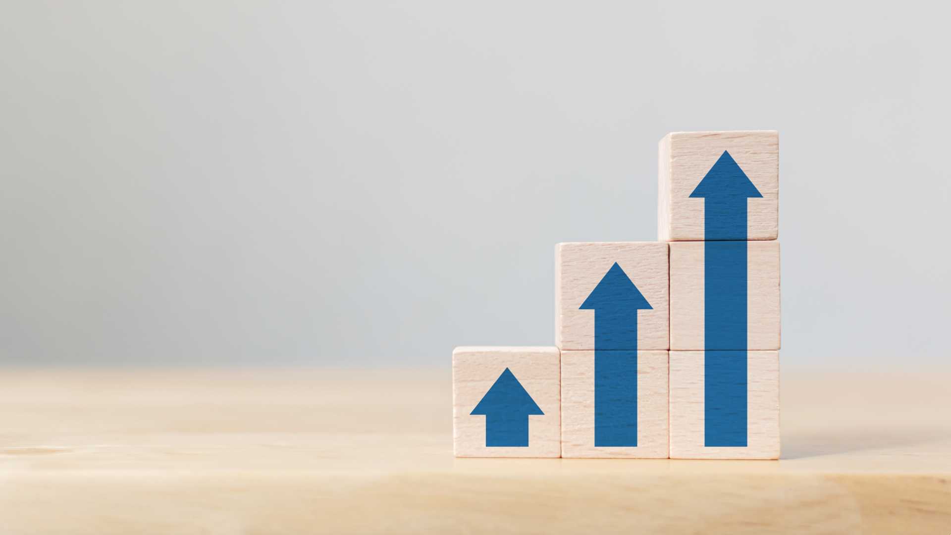 Building blocks stacked beside each other incrementally getting higher.