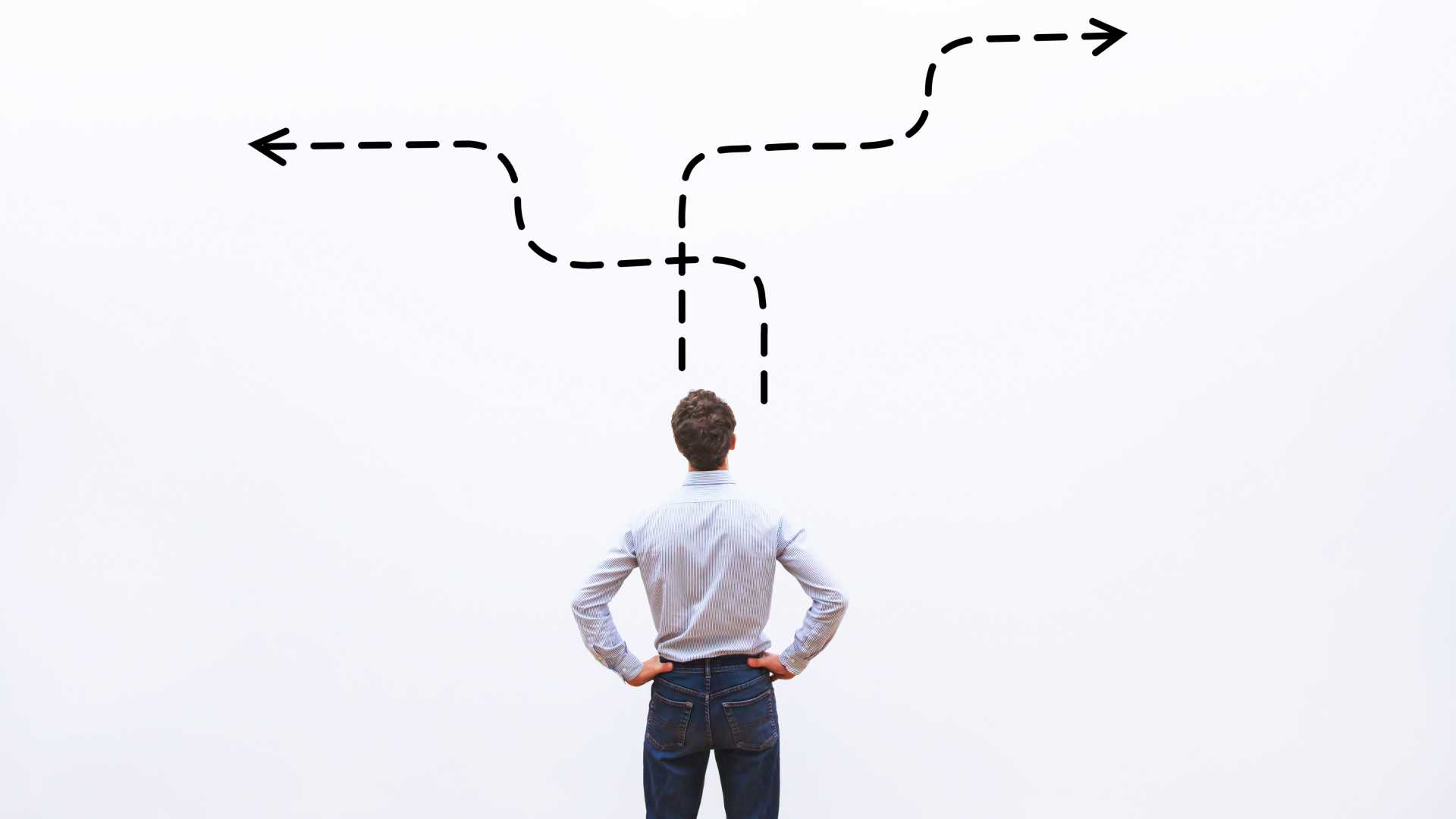 pensive businessman staring at two paths choosing direction