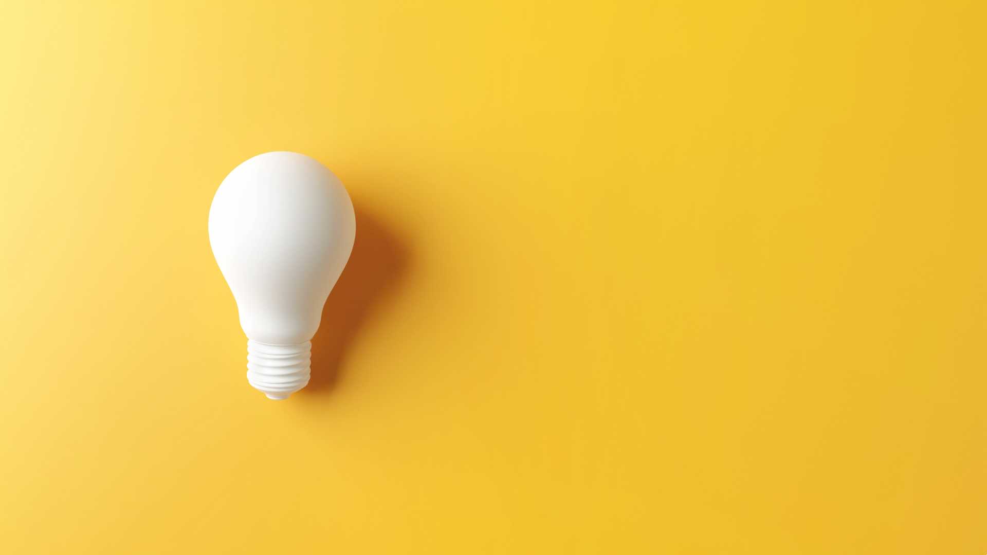 Lightbulb against yellow background.