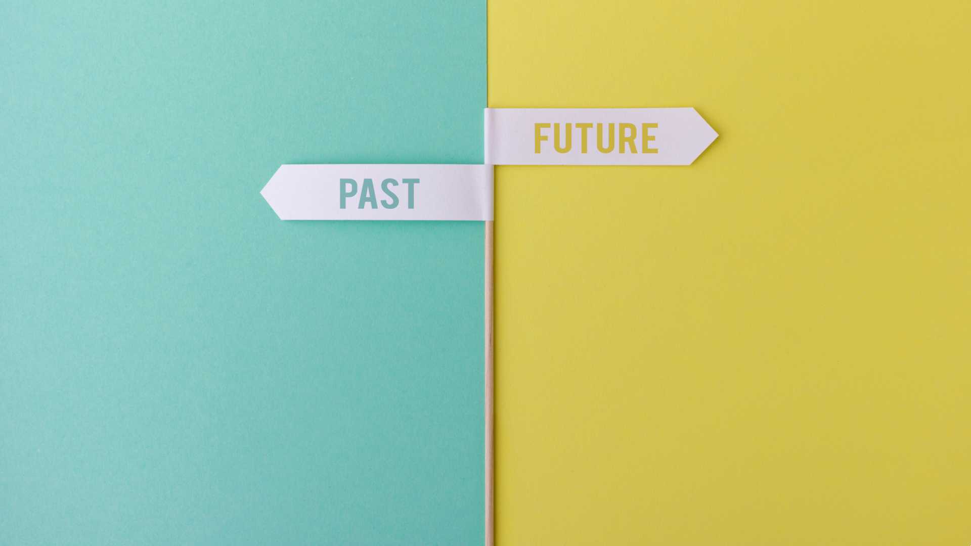 a signpost points to the left for the past and to the right for the future