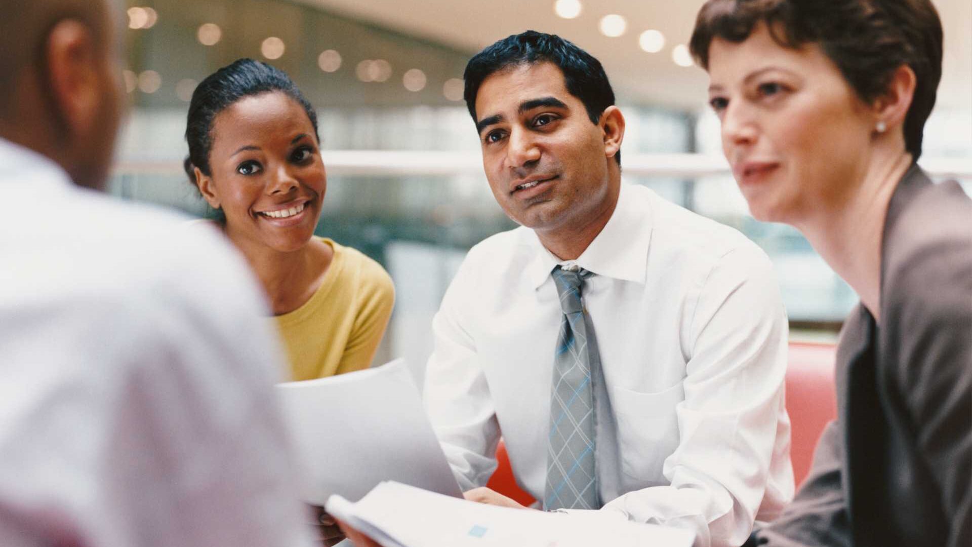 A group of executives collaborating in a work environment