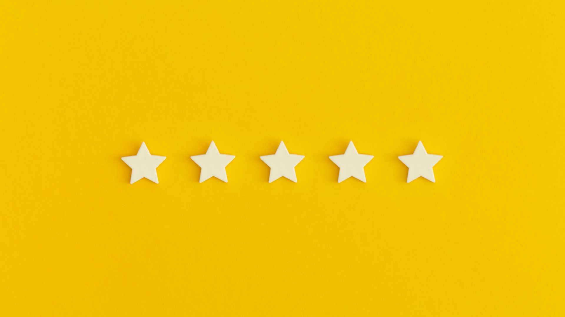 Five stars against a yellow background