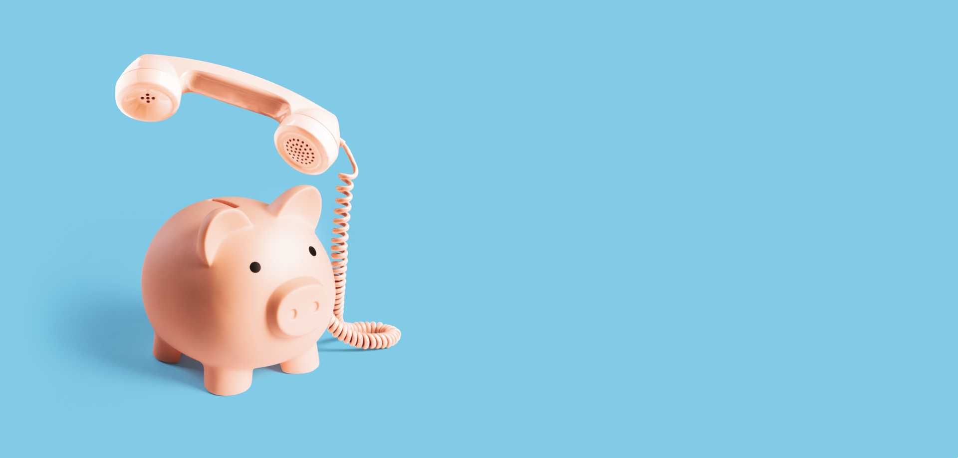 Pink piggy bank with phone attached, light blue background
