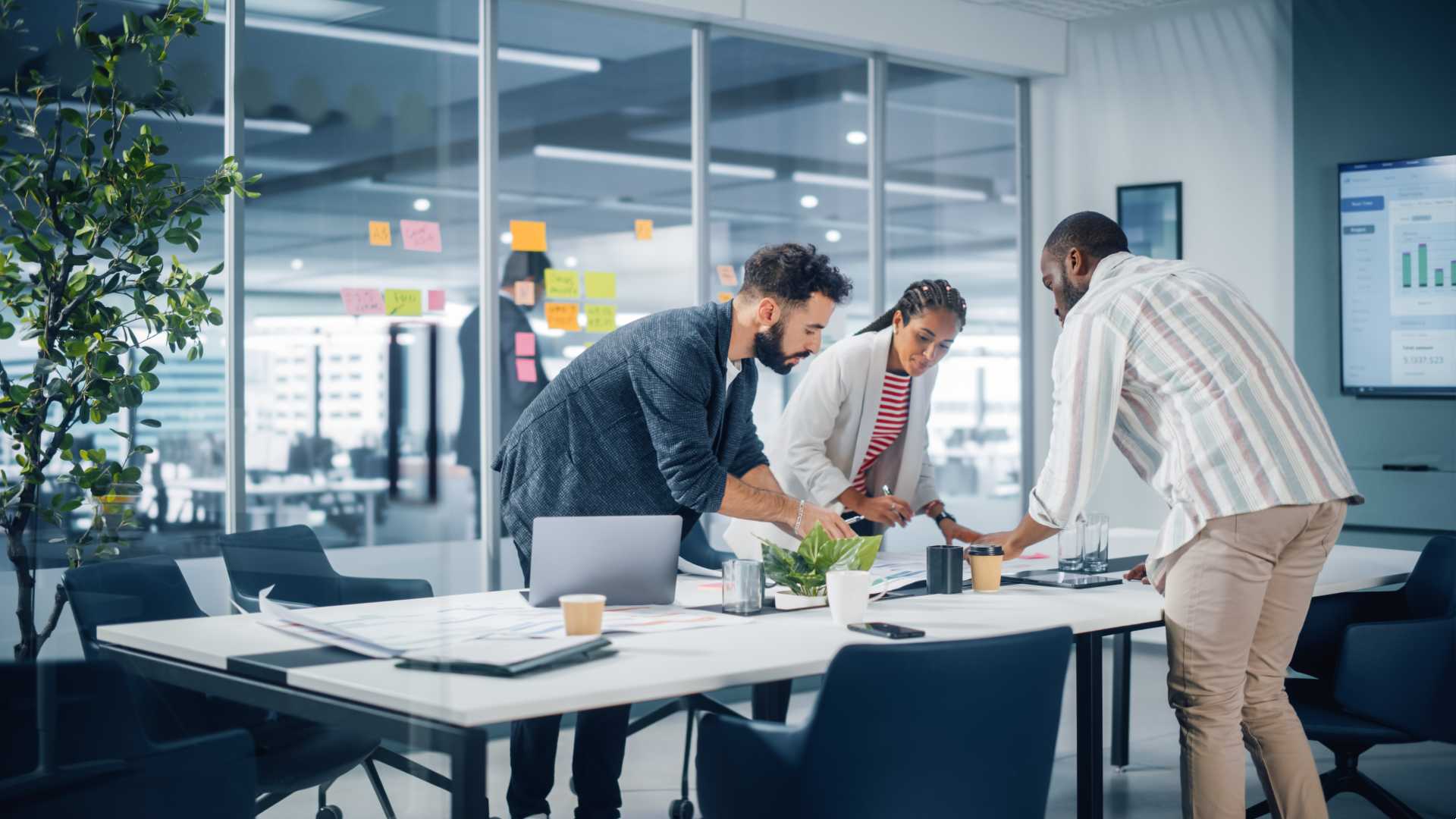 A team works together on a project in a conference room