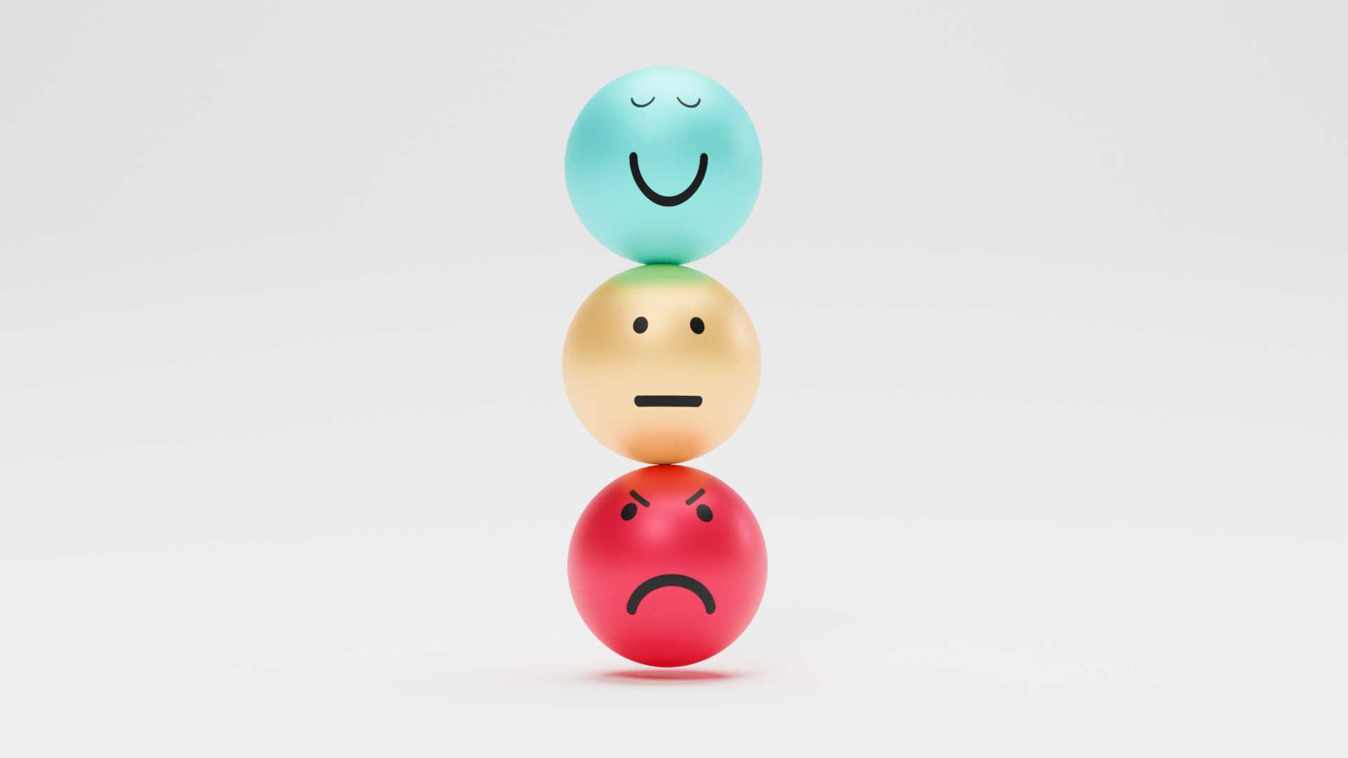 a blue smiley face emoji is stacked on top of a yellow straight-faced emoji and a red angry emoji