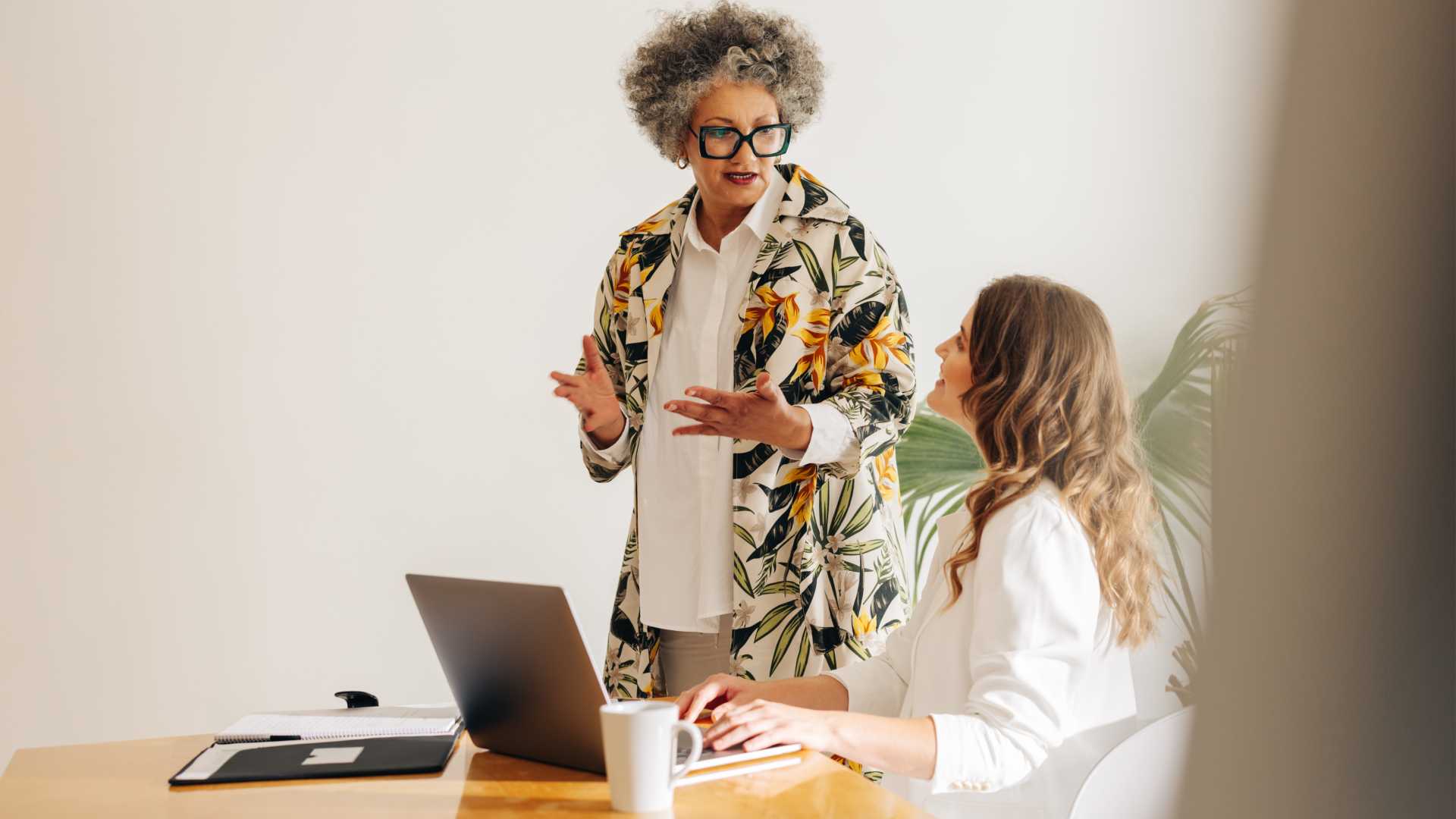 Two businesswomen working in an office environment