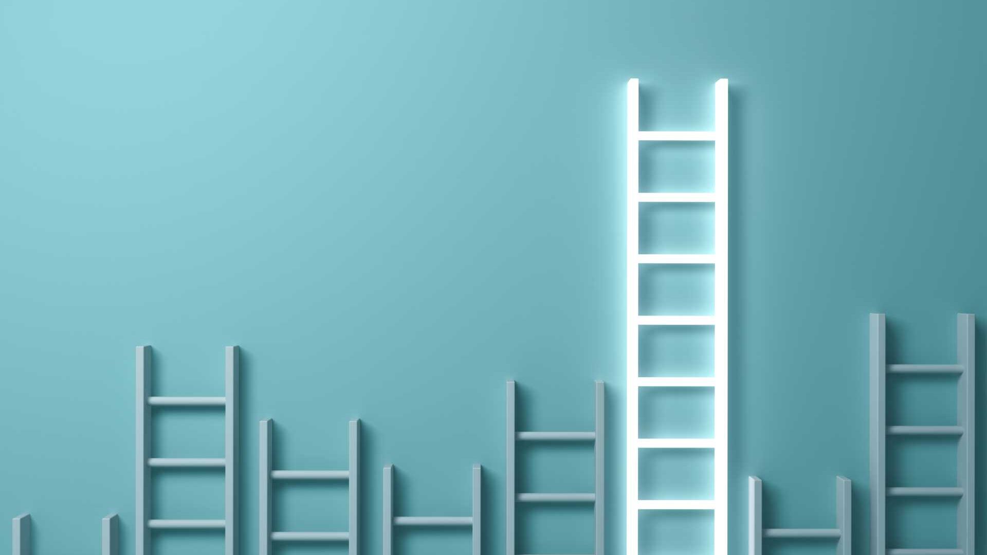 A concept image of ladders with one bright ladder representing growth and improvement