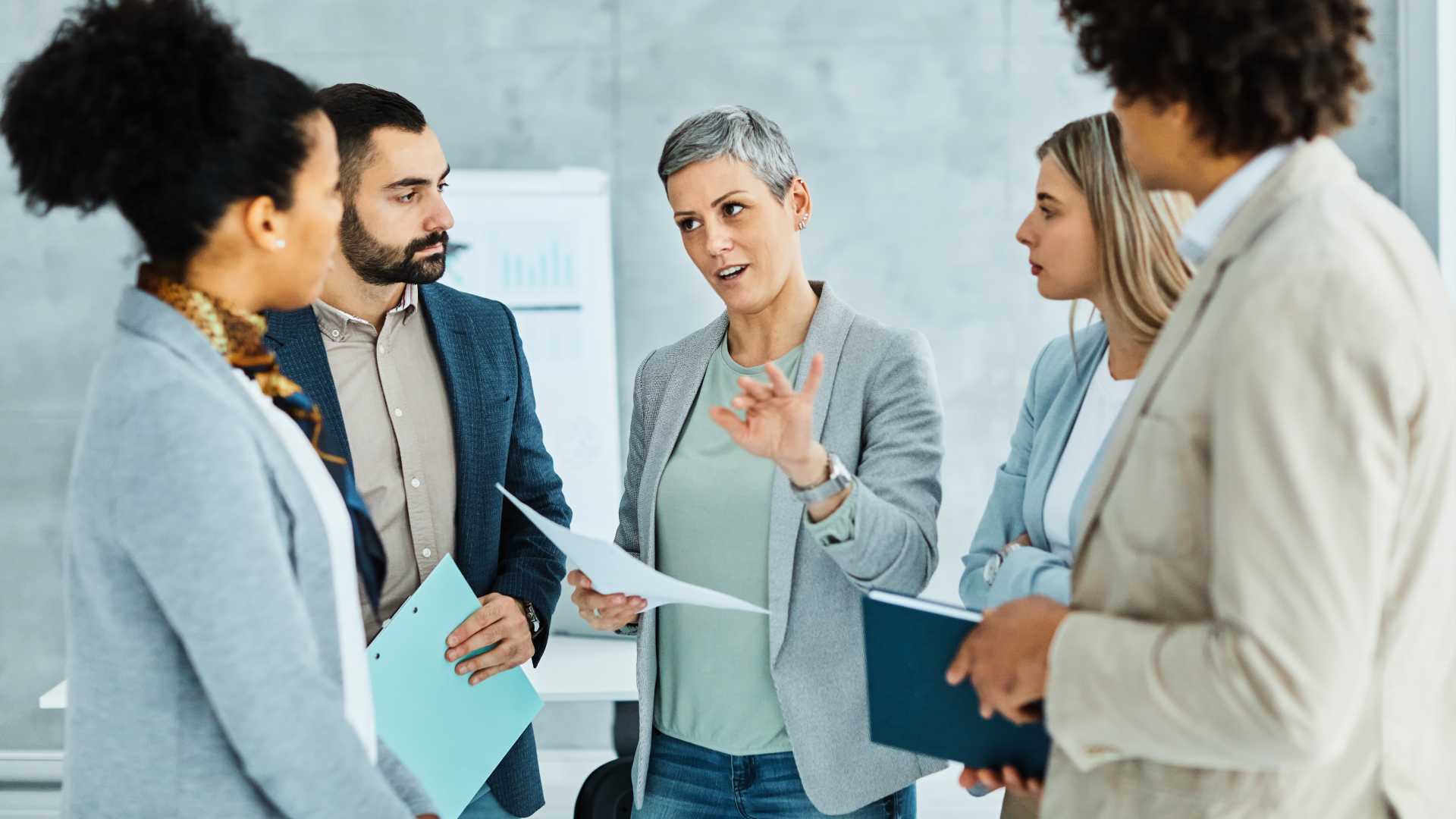A group of businesspeople collaborating in an office environment
