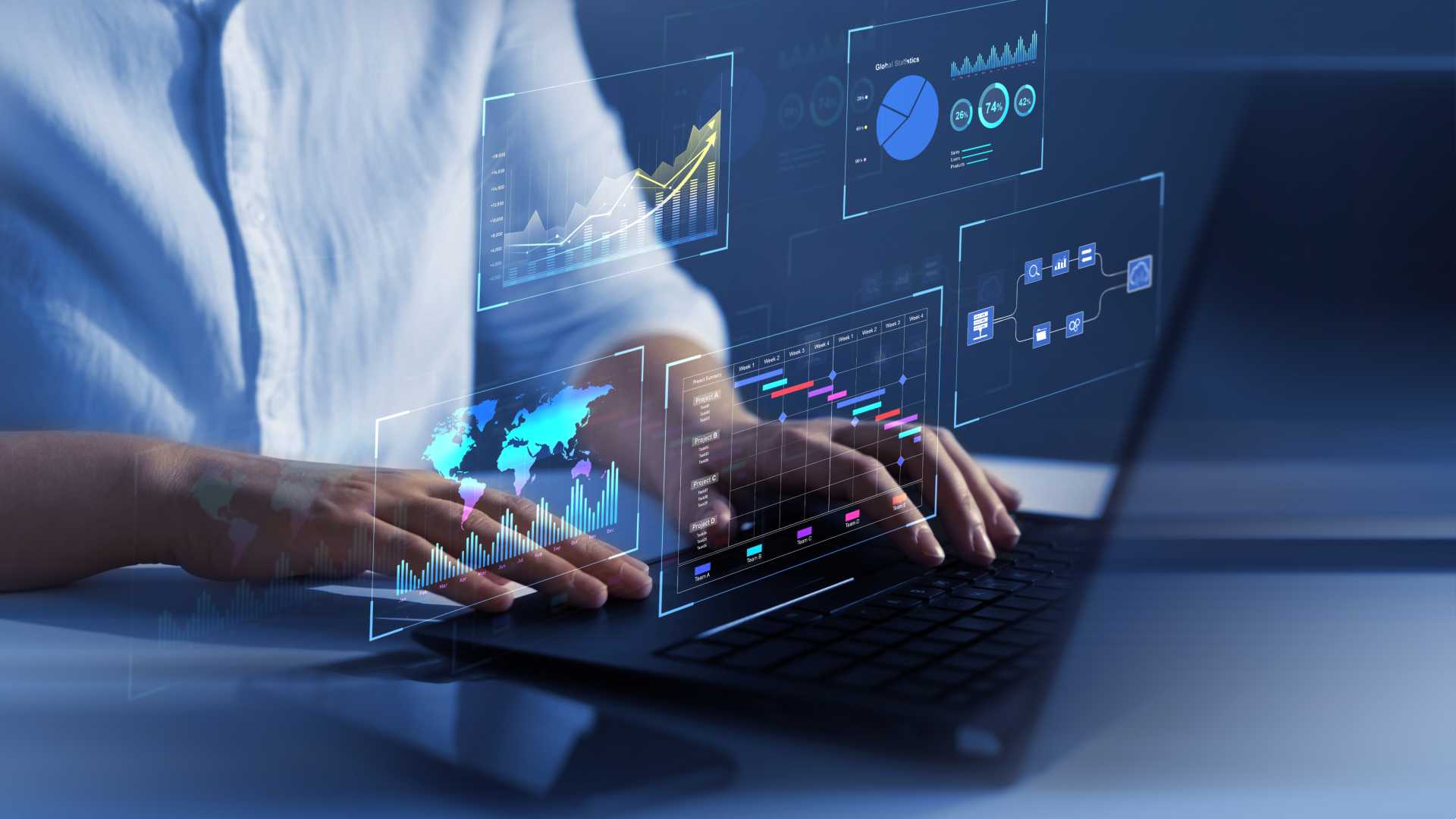a person is using a laptop with a projected image of charts and graphs