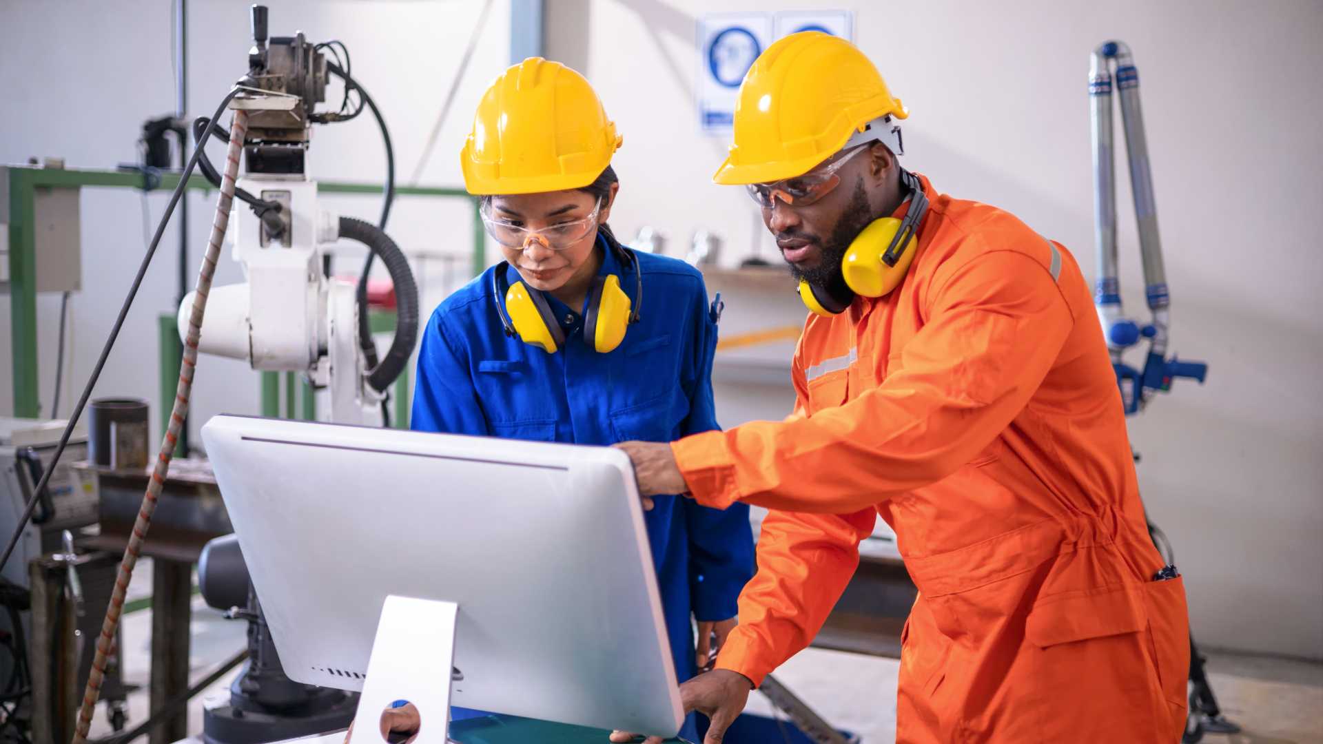 Two people looking at a computer