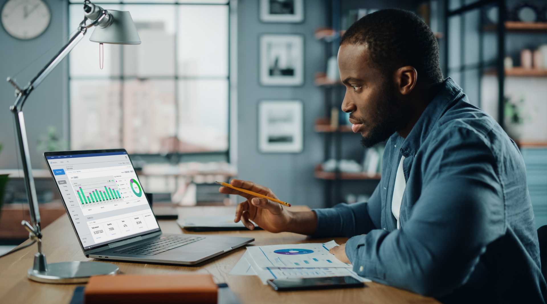 Male working on digital training on his laptop