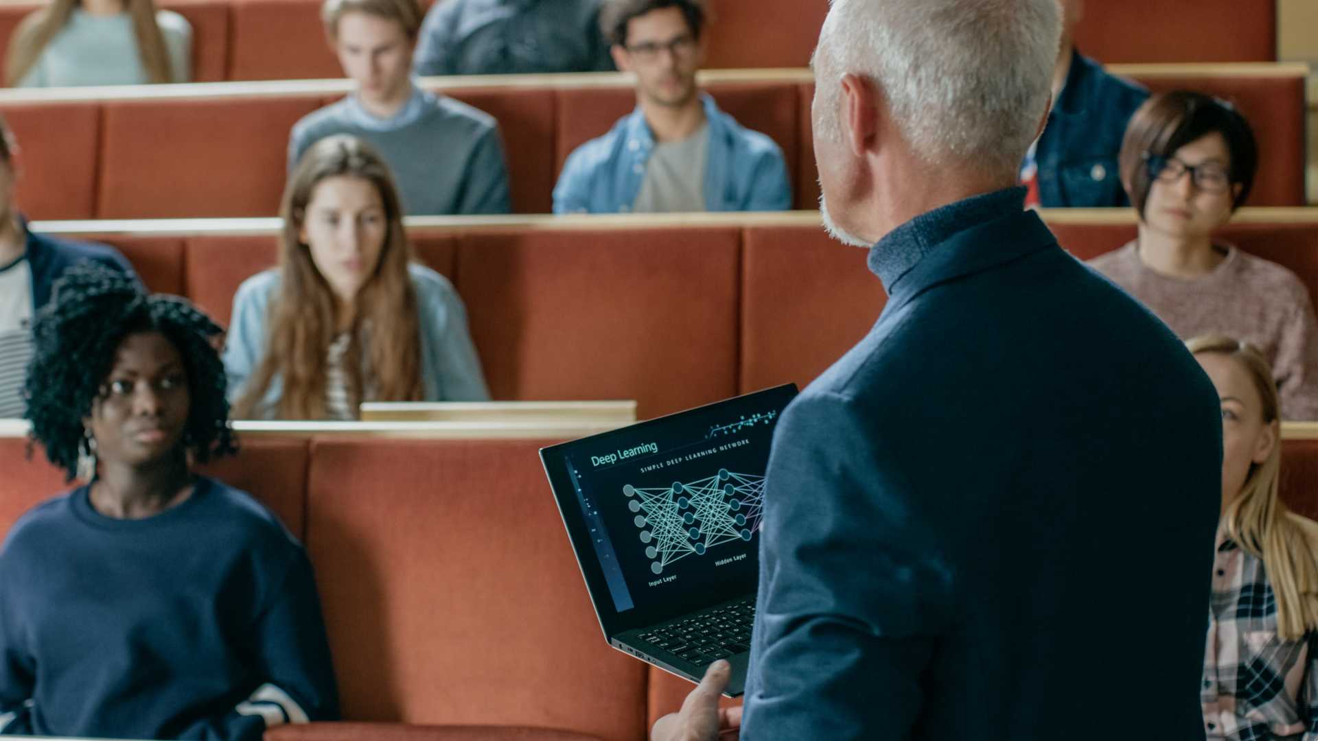 Professor lectures to a Classroom Full of Students.