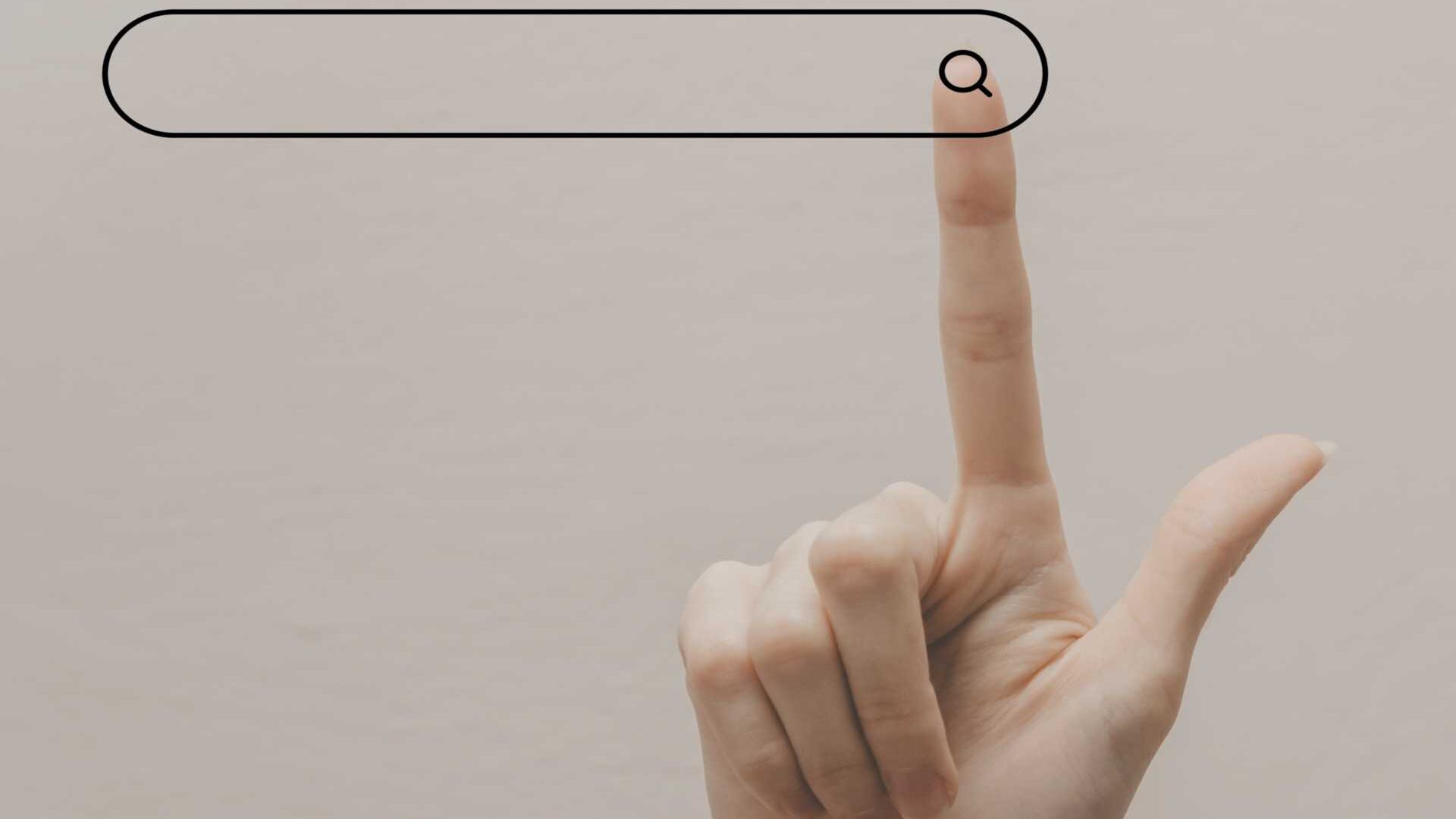 Hand touching a search bar