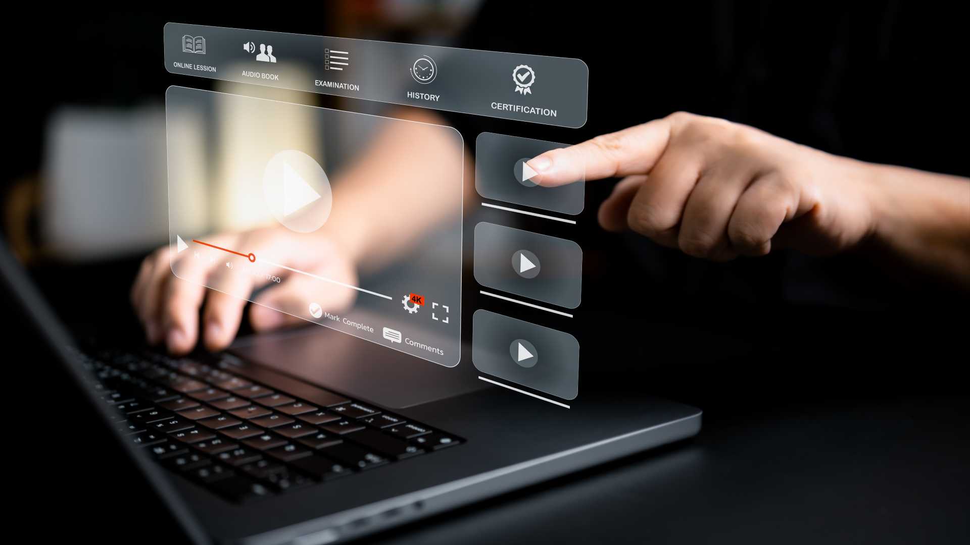 a laptop with a projected image of a video module a person is pressing buttons on