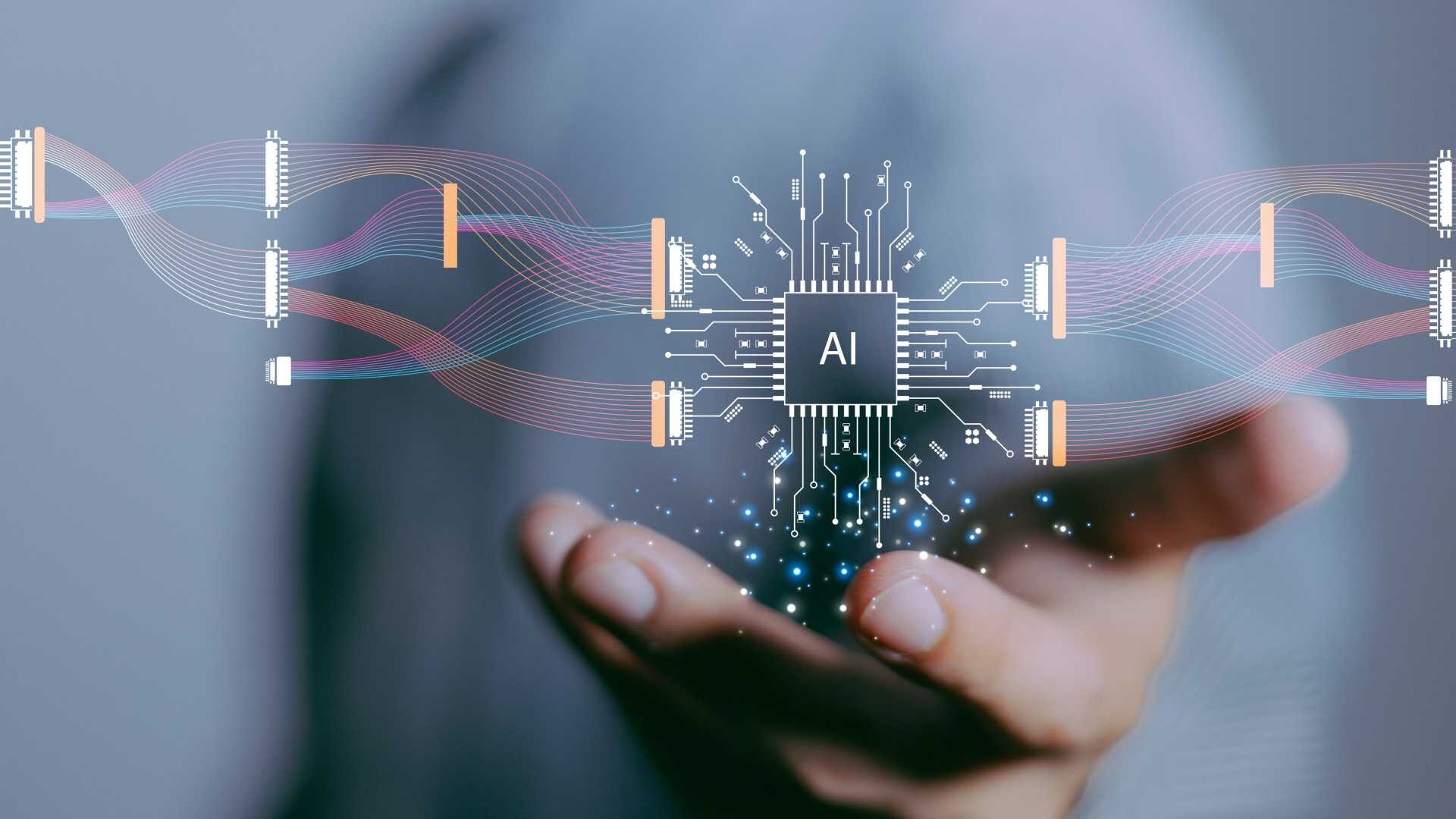 A hand is laid out holding an AI symbol