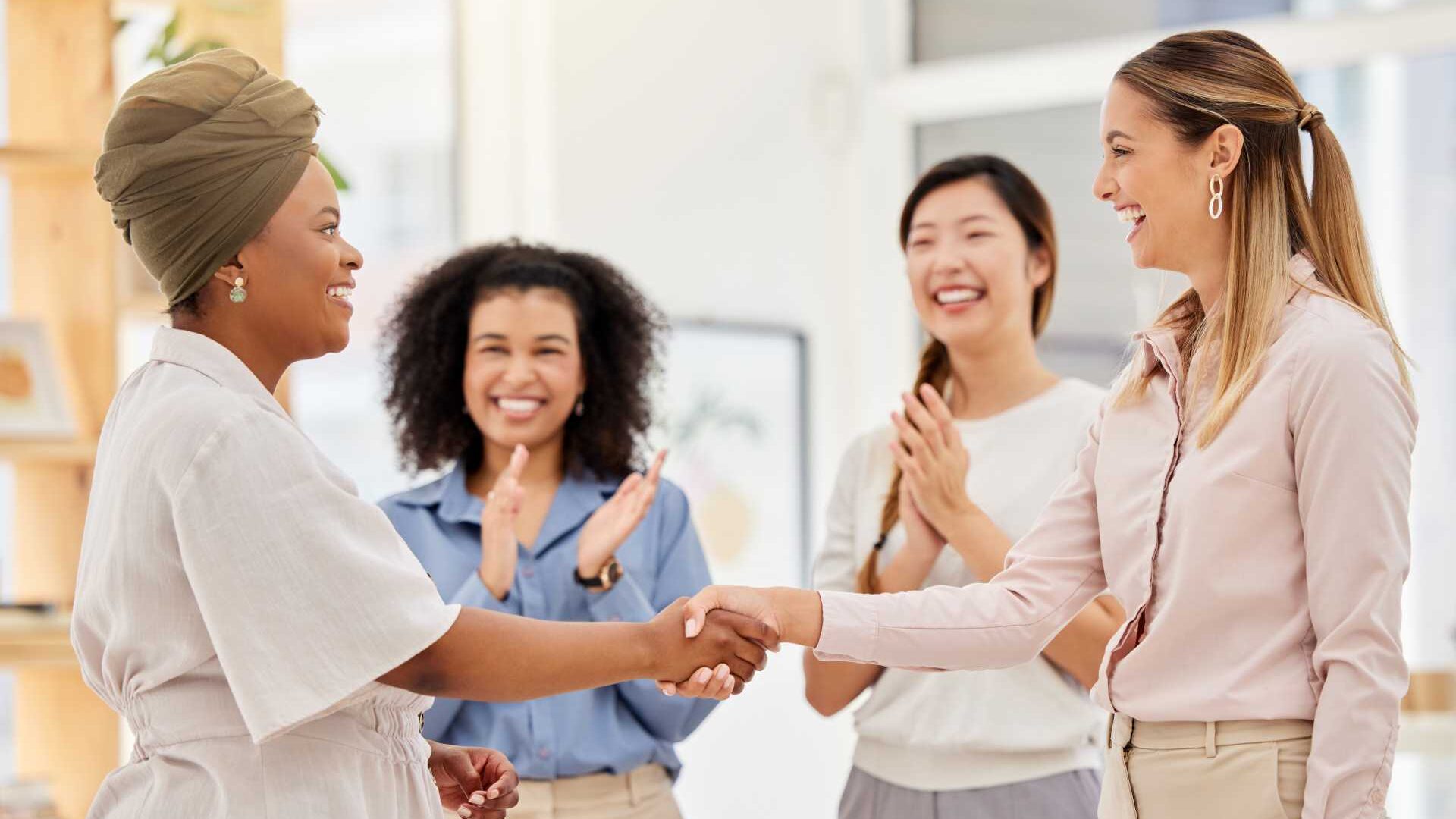 Women standing in circle talking about an issue
