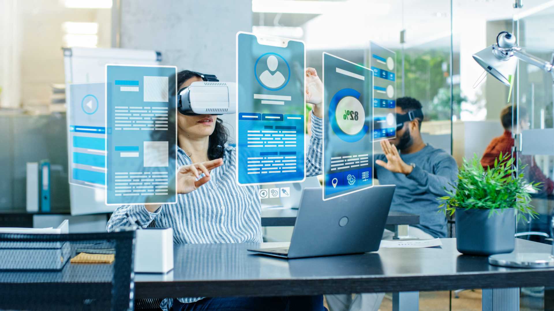 Female wearing VR headgear and using AI tools to do work.