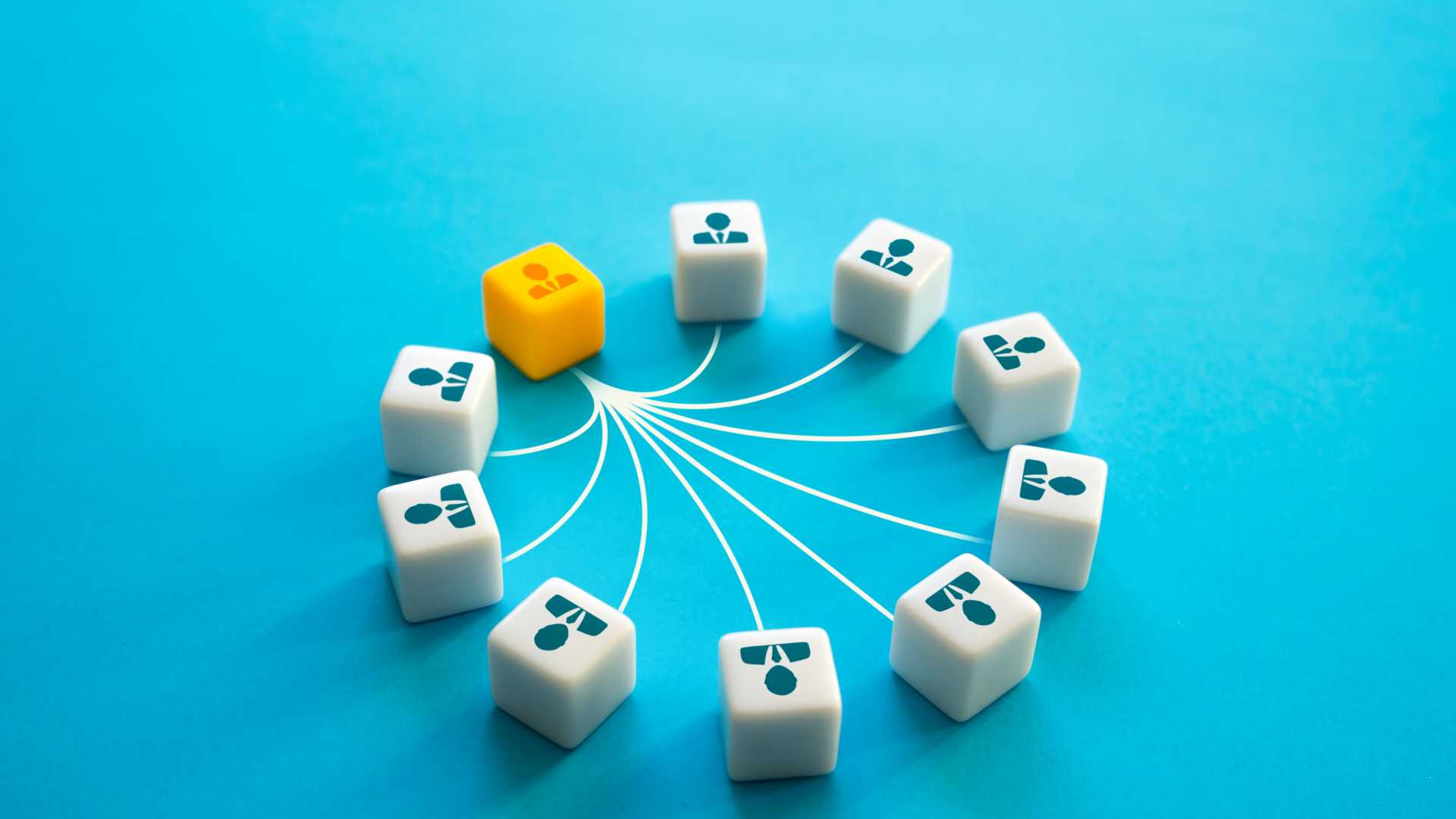 Cubes of cartoon people leading back to one yellow cube. Teammates are connected to leader.