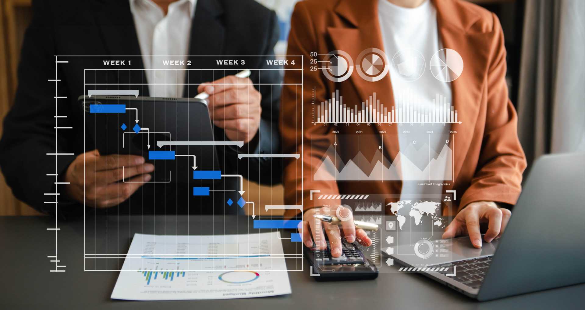 Two people siting side by side looking at electronic renderings of data representing learning and development cultures