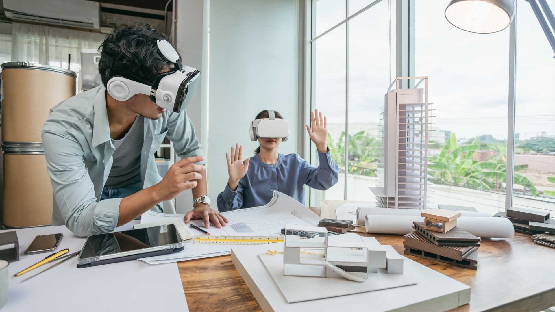 Coworkers using VR for job training.