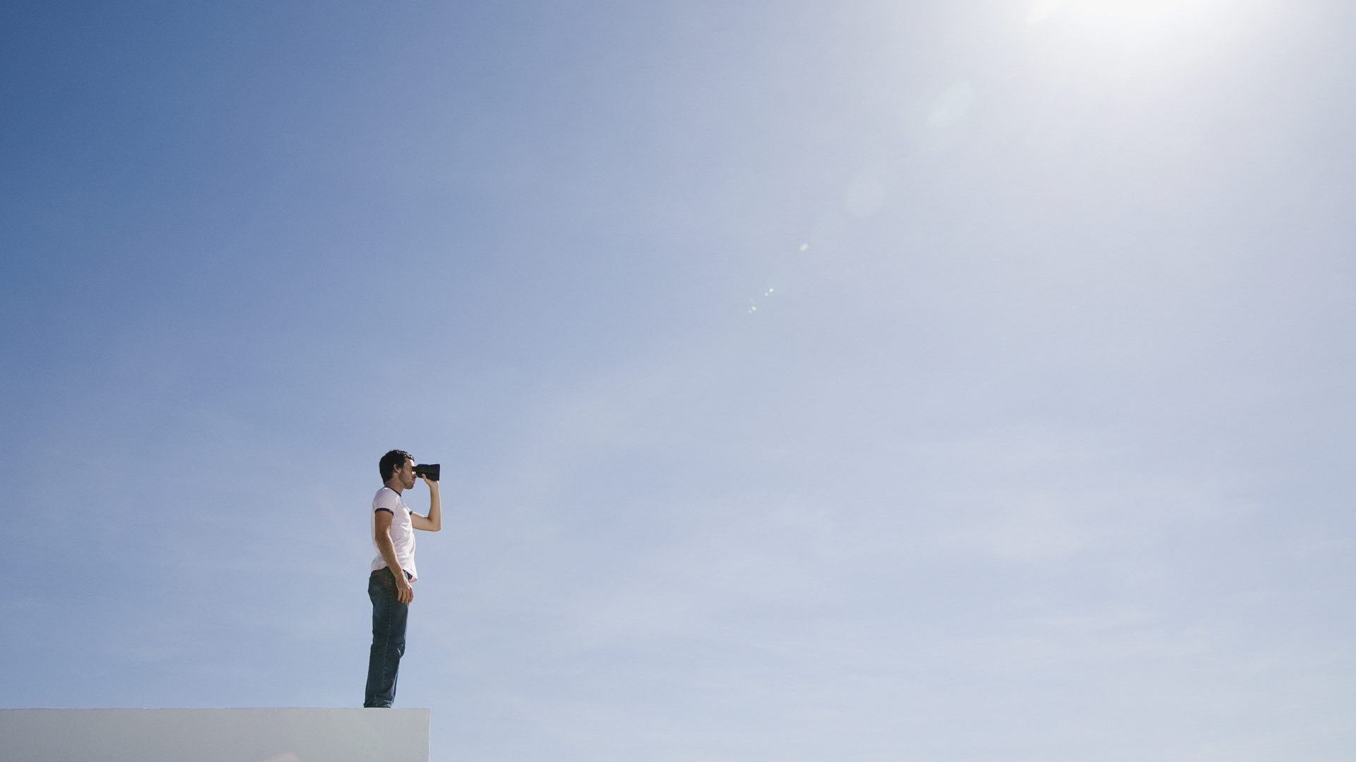 Man staring off into the sun.