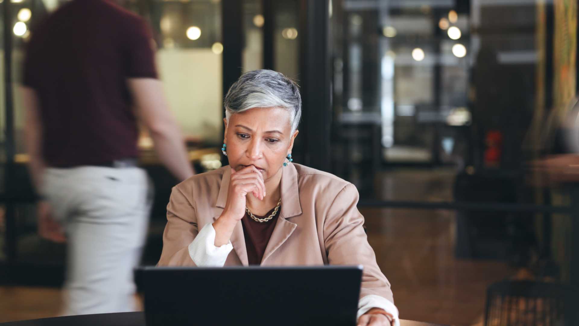 Woman Staring at her laptop with a puzzled look.
