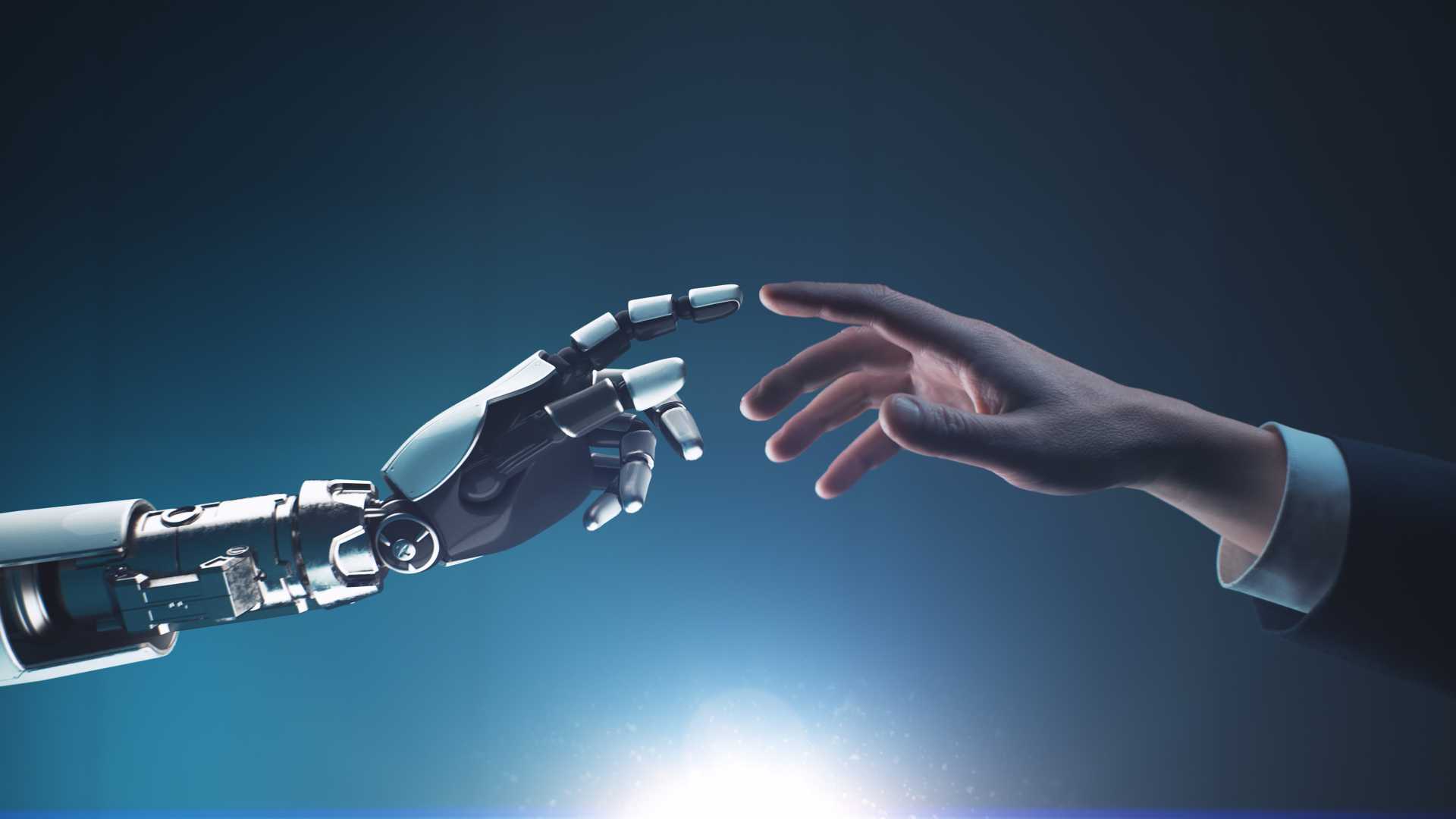 Robot Hand and Human Hand almost touching.