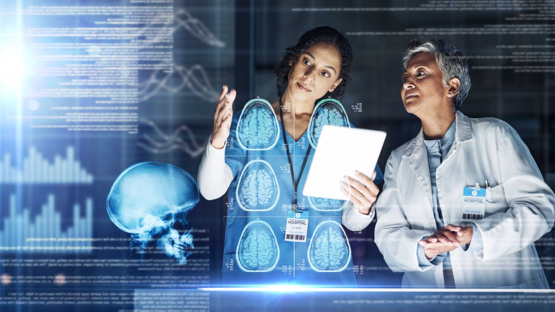 Two co-workers viewing a digitally 3-D model of healthcare results.