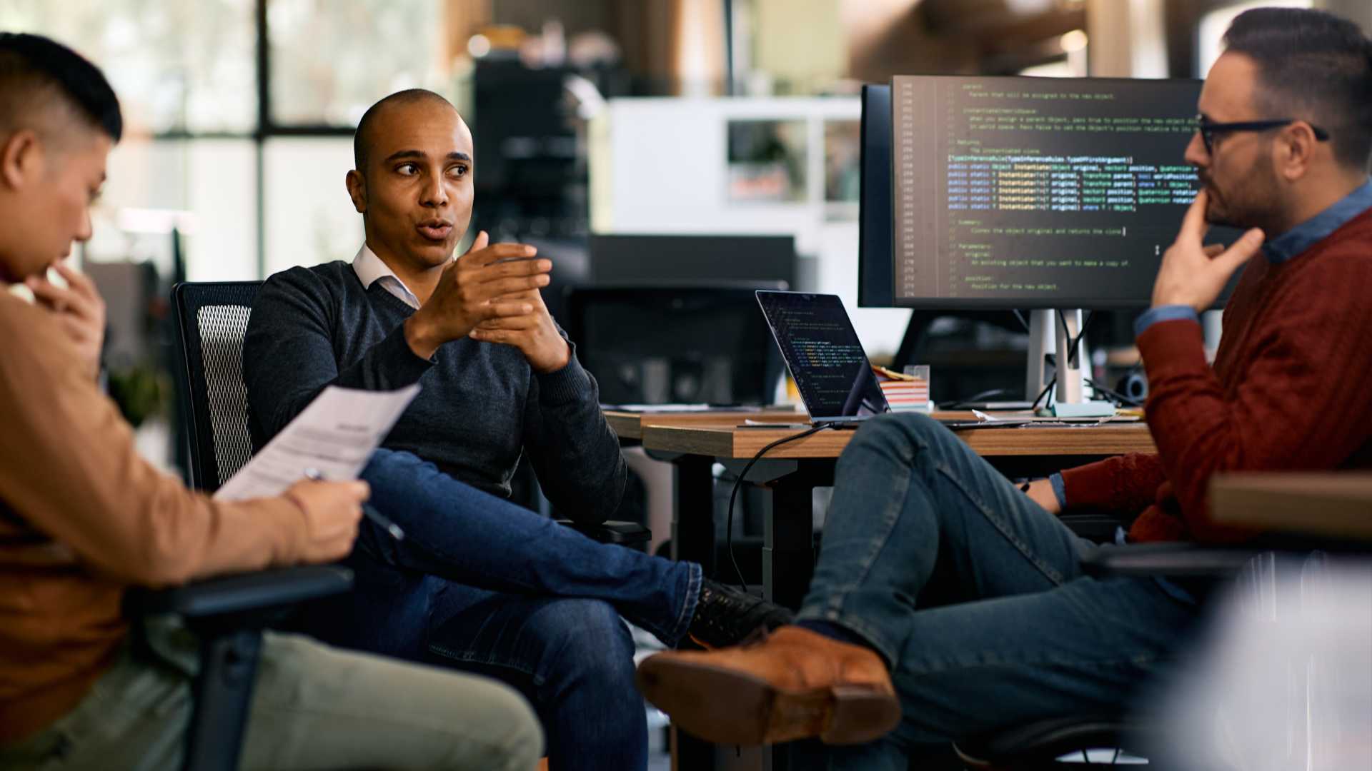 Group of Co-workers together discussing next project.