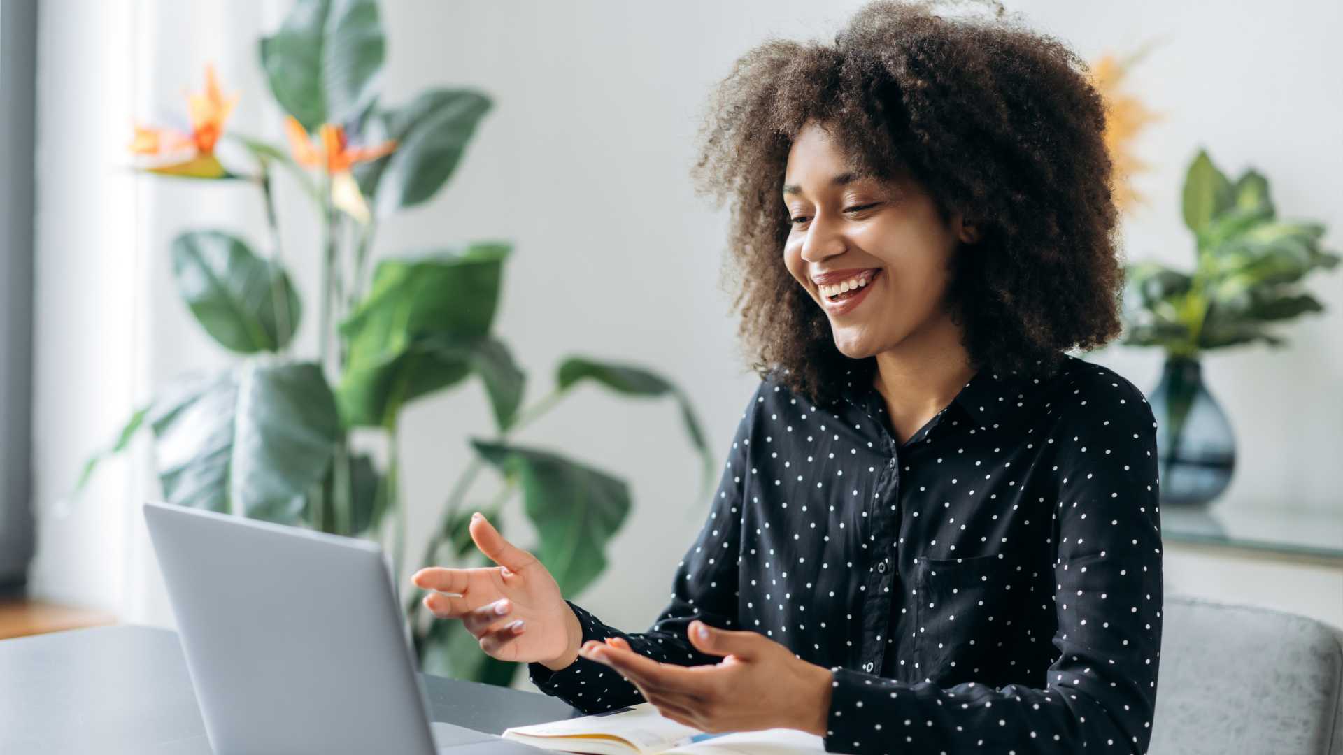 Woman looking at her laptop in a meeting.