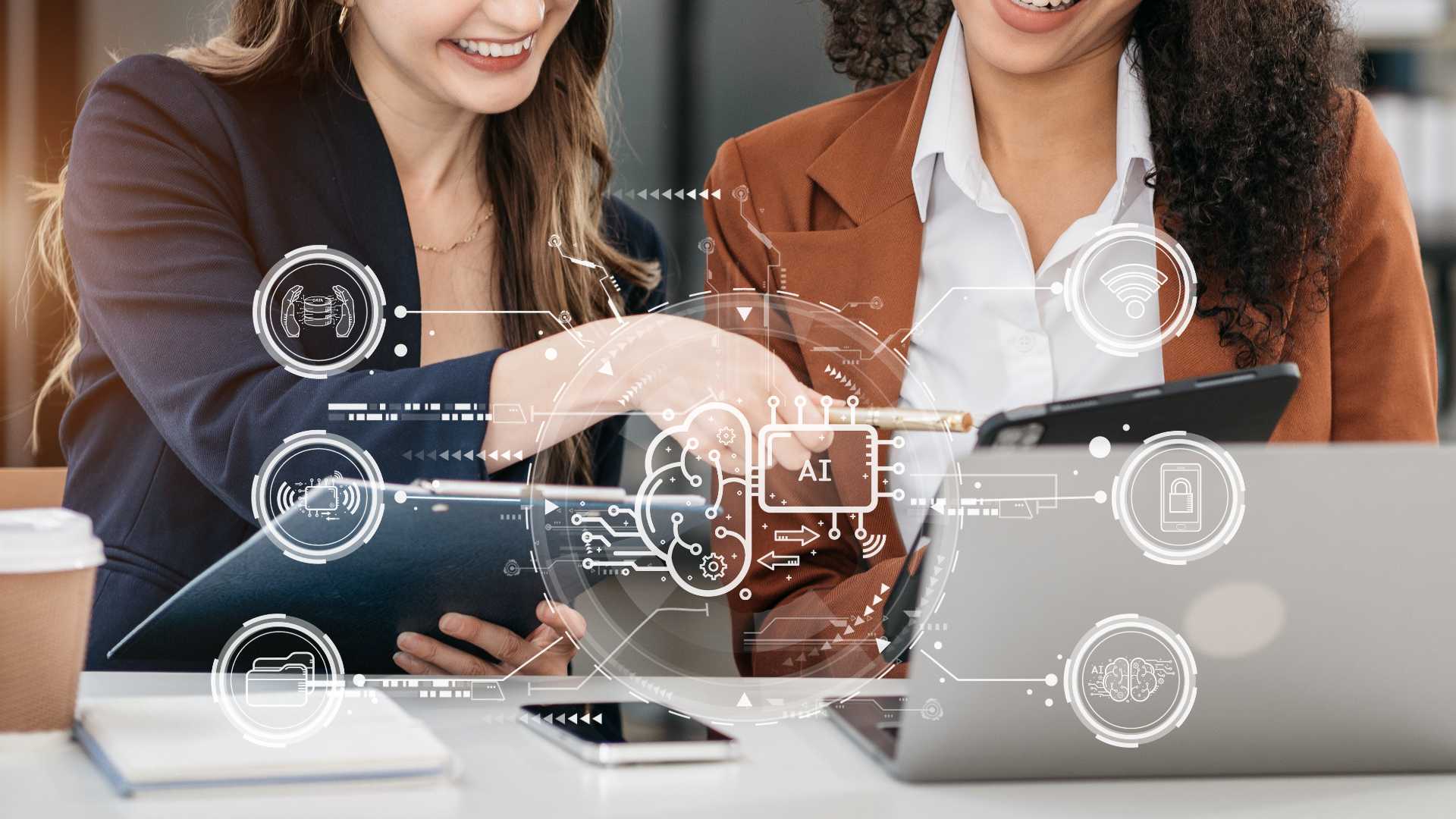 Two female coworkers looking over AI document.