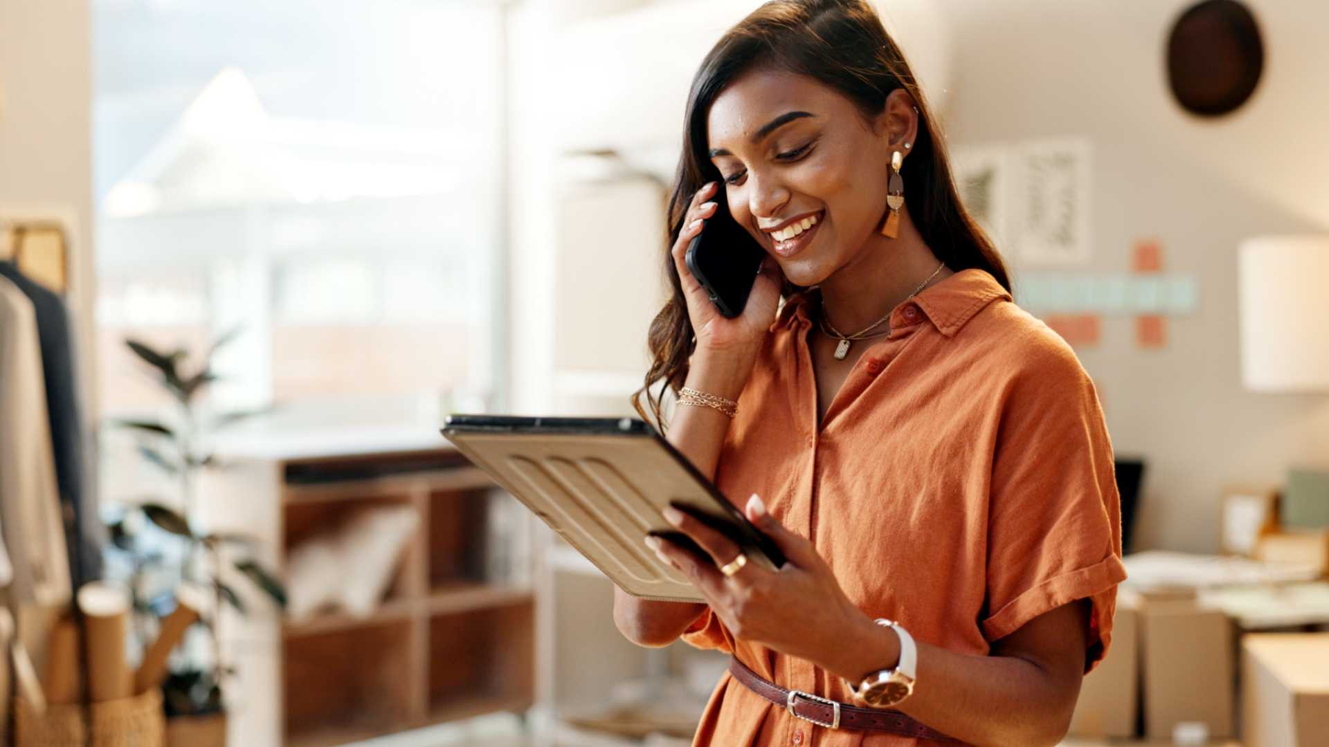 Young woman looking at her iPad for work.