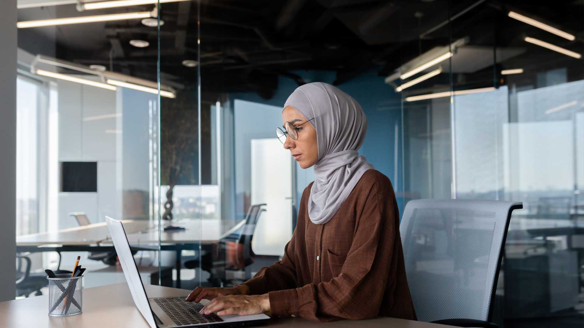 Woman working on something using her laptop.