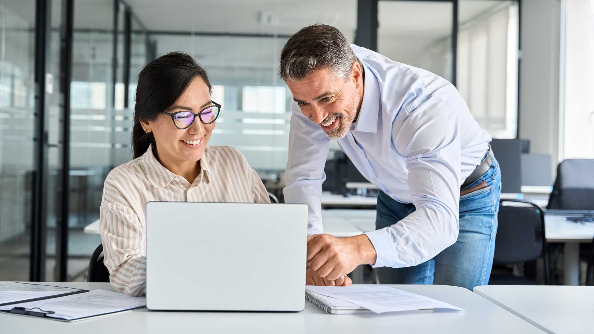 Woman and man collaborating on a project together.