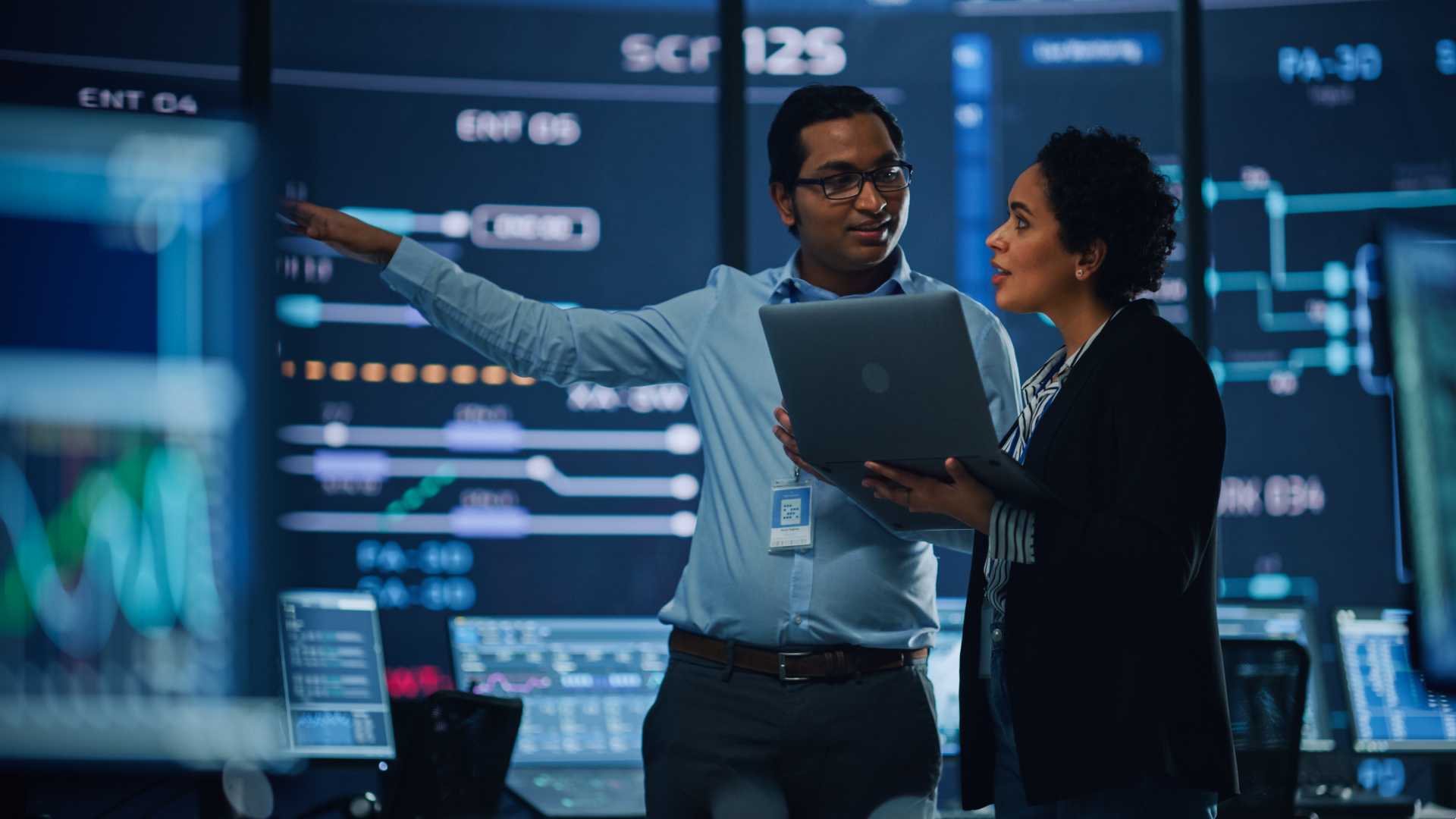 Co-workers looking at data together,