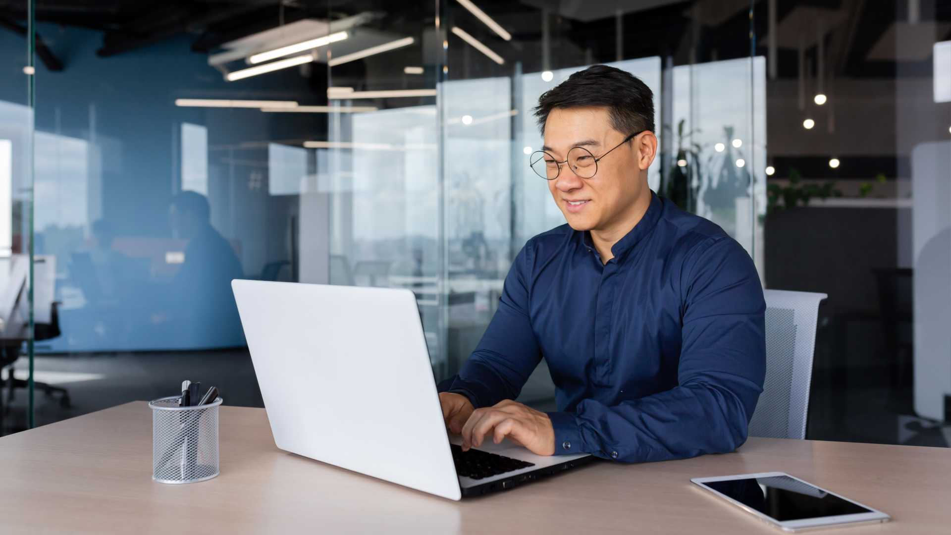 Man looking at work on a computer.